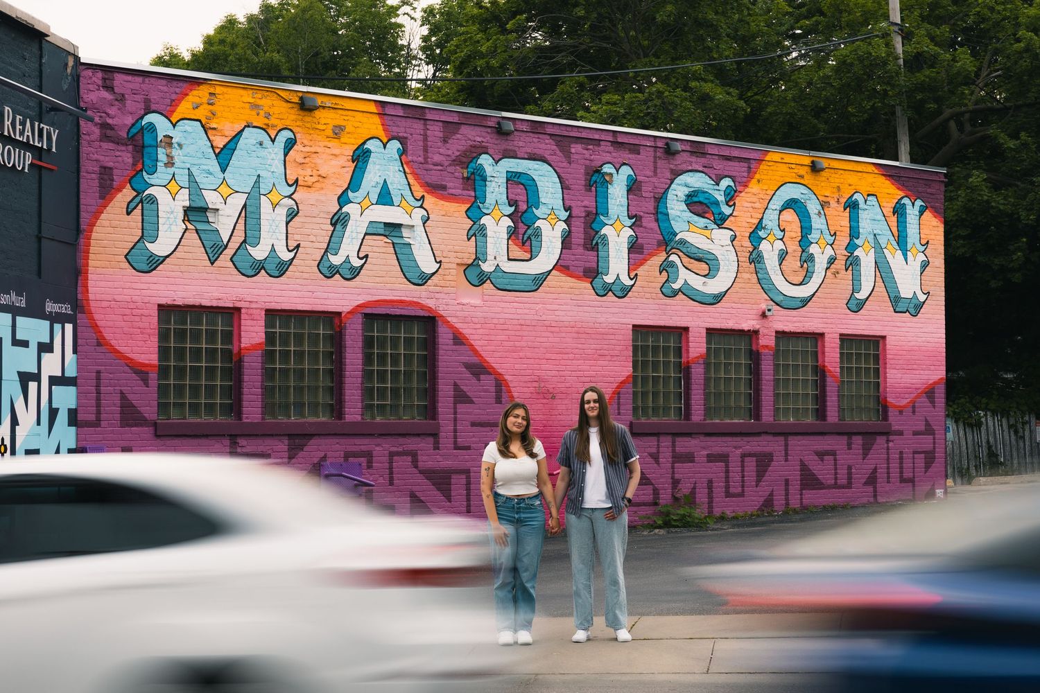 madison wi engagement couples photographer monroe street mural triangulador moving cars city pictures unique colorful lgbtq same sex photos