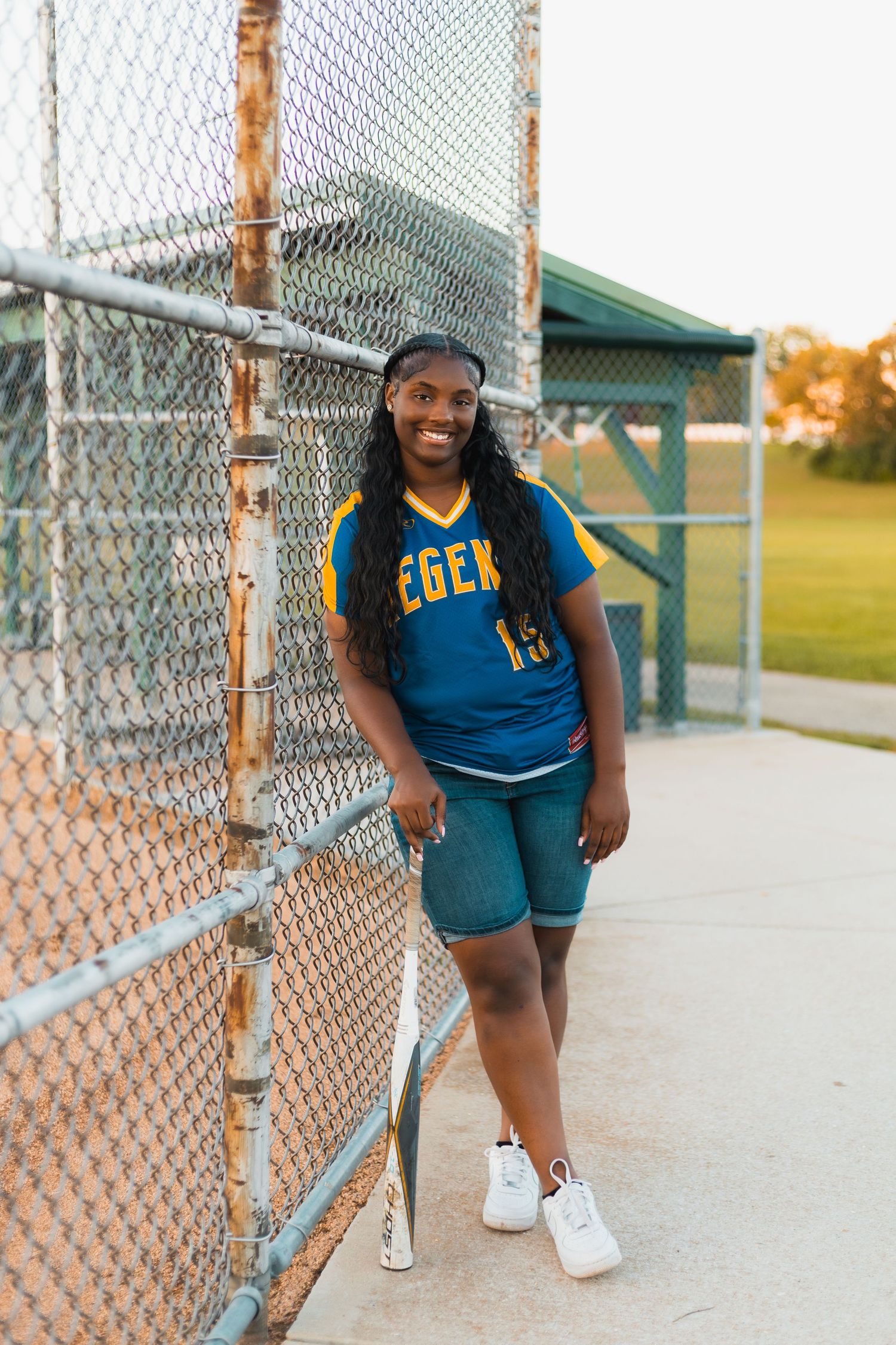 high school senior photographer in Madison, WI Little Dragan Photography west side regents baseball softball sports uniform dugout golden