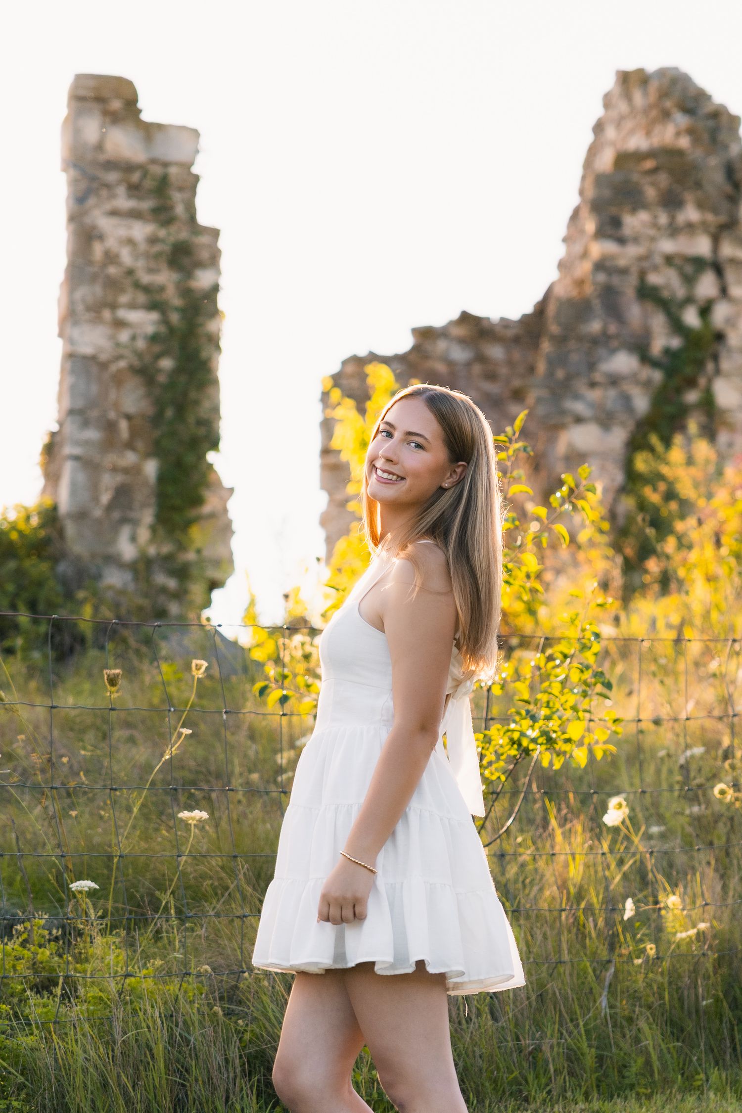 high school senior photographer in Madison, WI west side cross plains Indian Lake County Park golden hour white dress Matz Farmstead Ruins