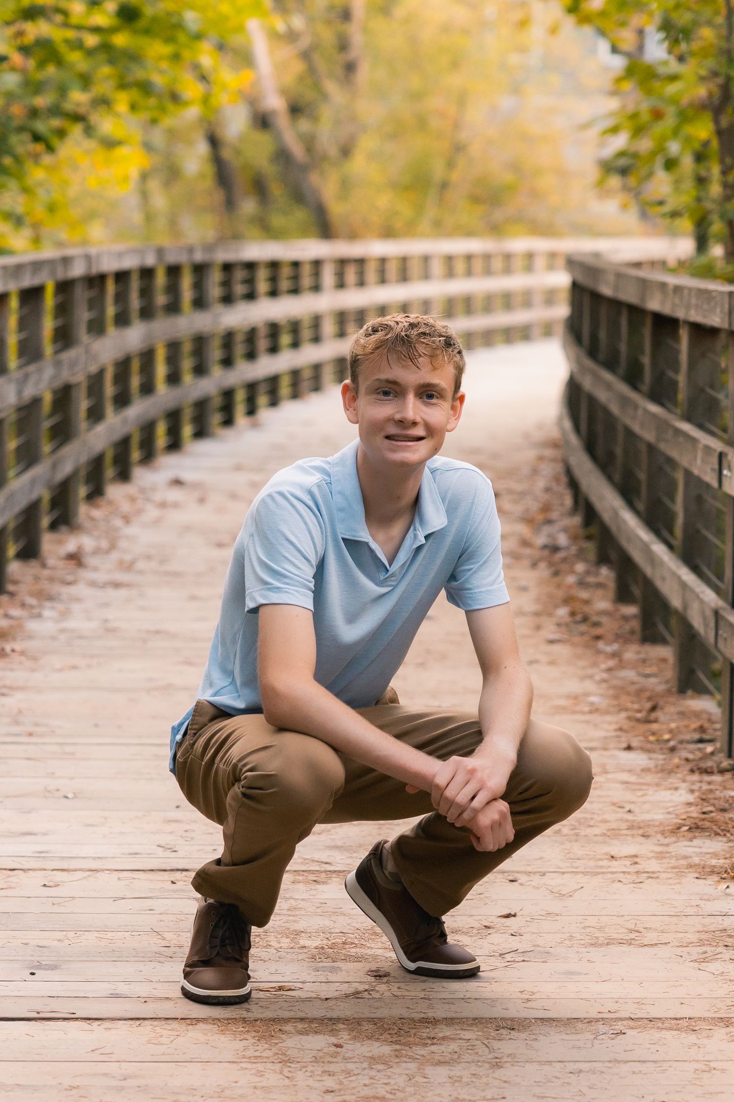 unique locations for senior photos Madison, WI Little Dragan Photography high school portraits epic campus verona long bridge boy pose dane