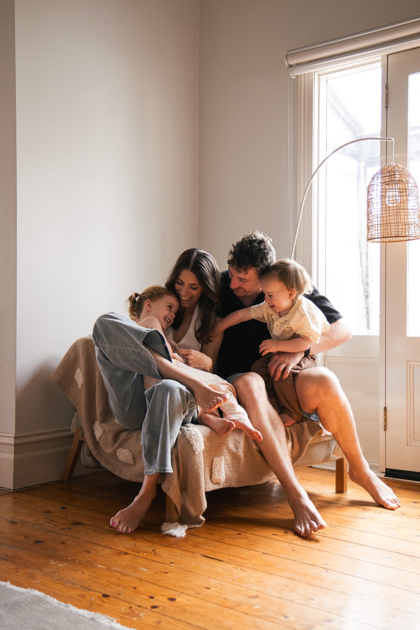Sequence of artistic dance poses on wooden floor with sunlight streaming through windows.