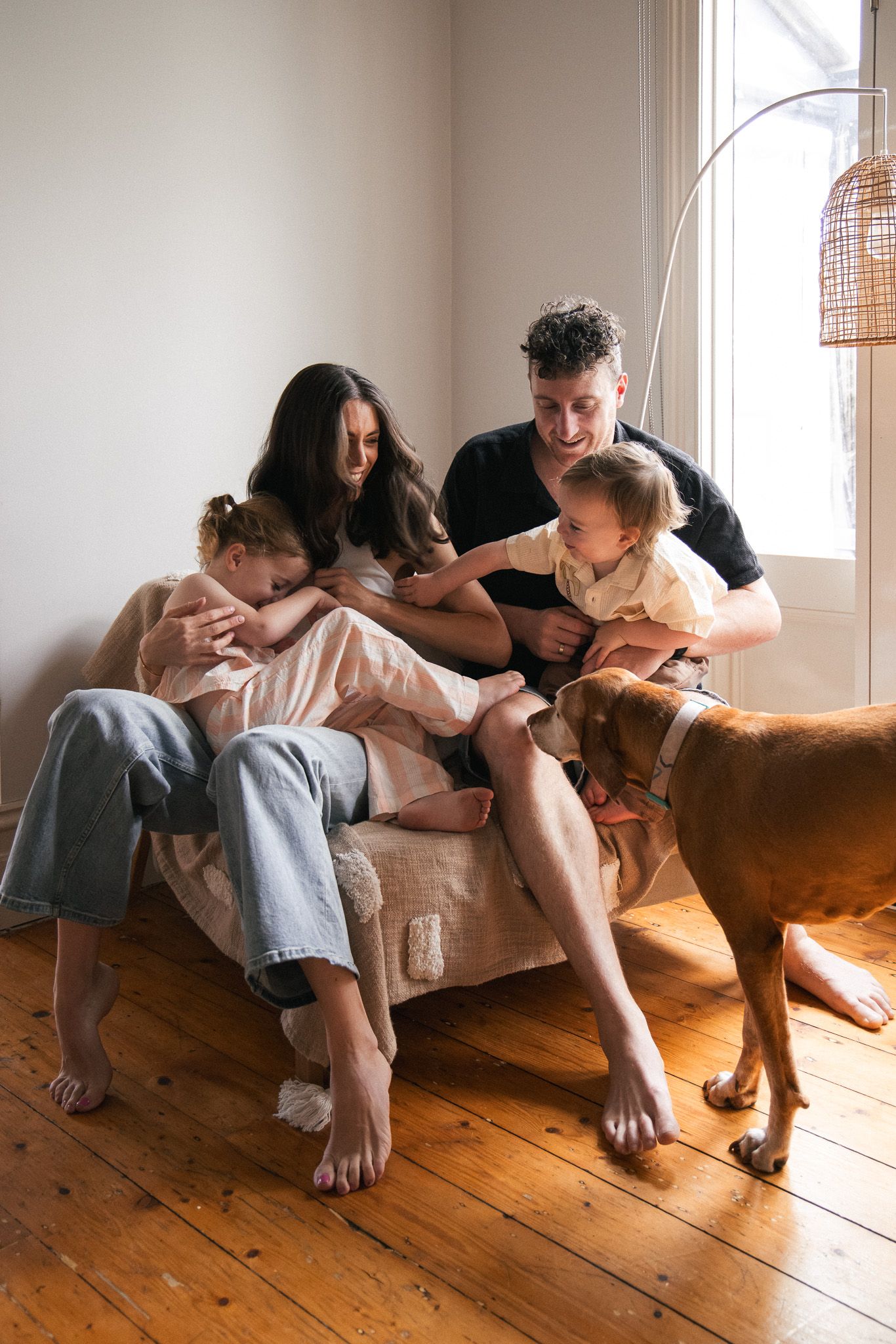 A series of intimate lifestyle photos showing a couple lounging together on wooden floors in natural window light.