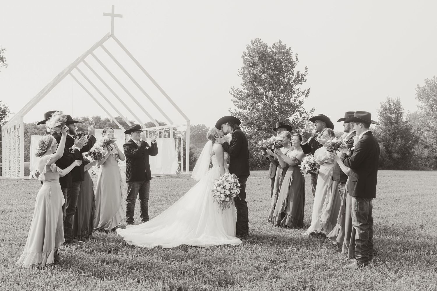 Vintage wedding ceremony photos showing guests gathered under a white tent with a cross.