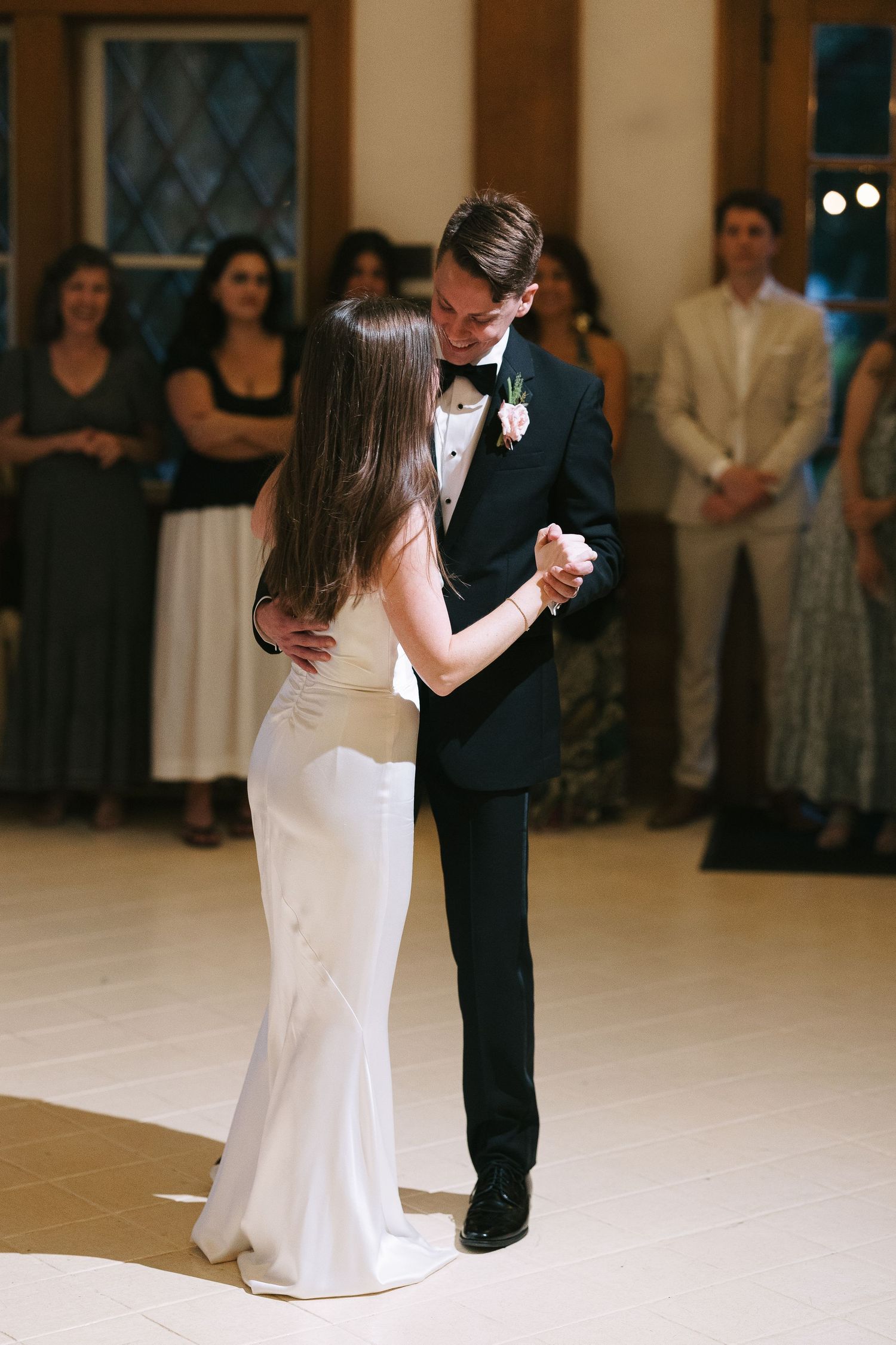 A formal dance between two people in elegant attire.