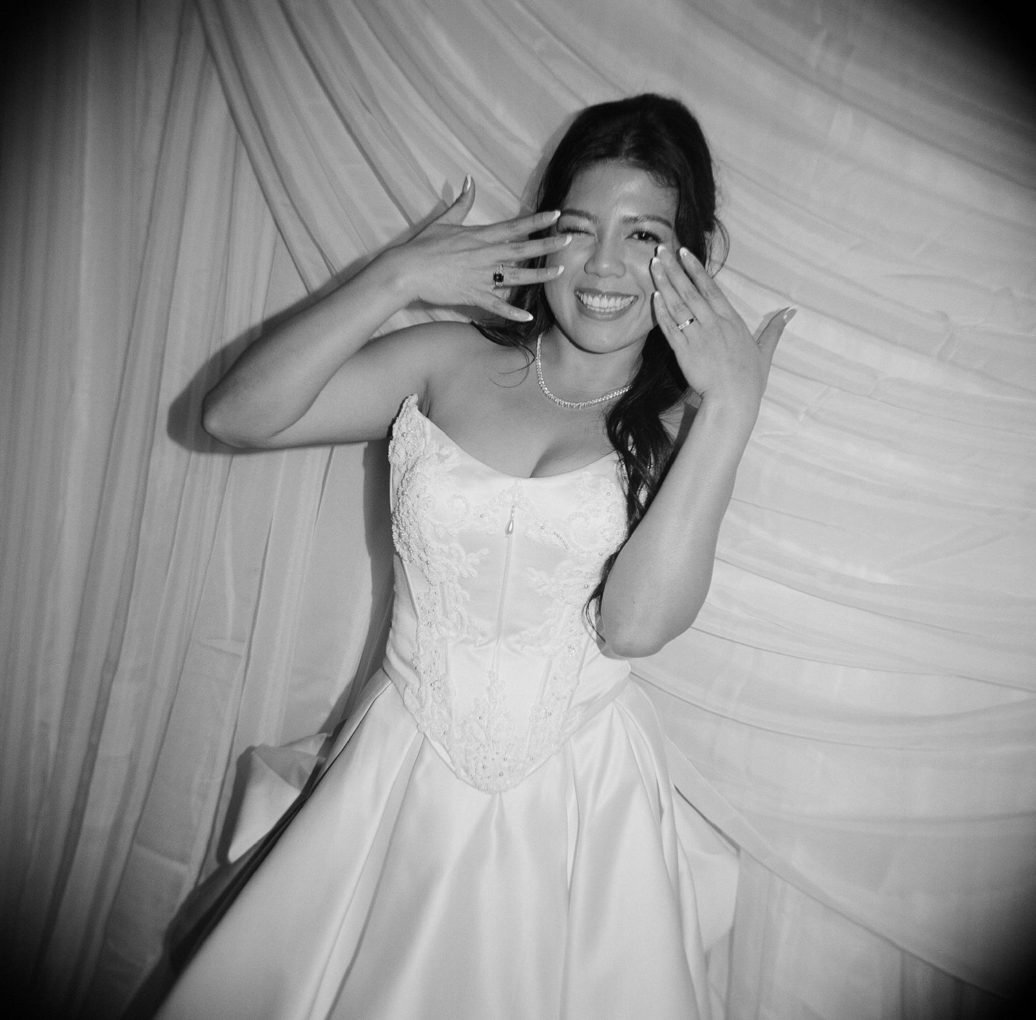 A sequence of black and white photos showing joyful candid moments in a wedding dress against a light background.
