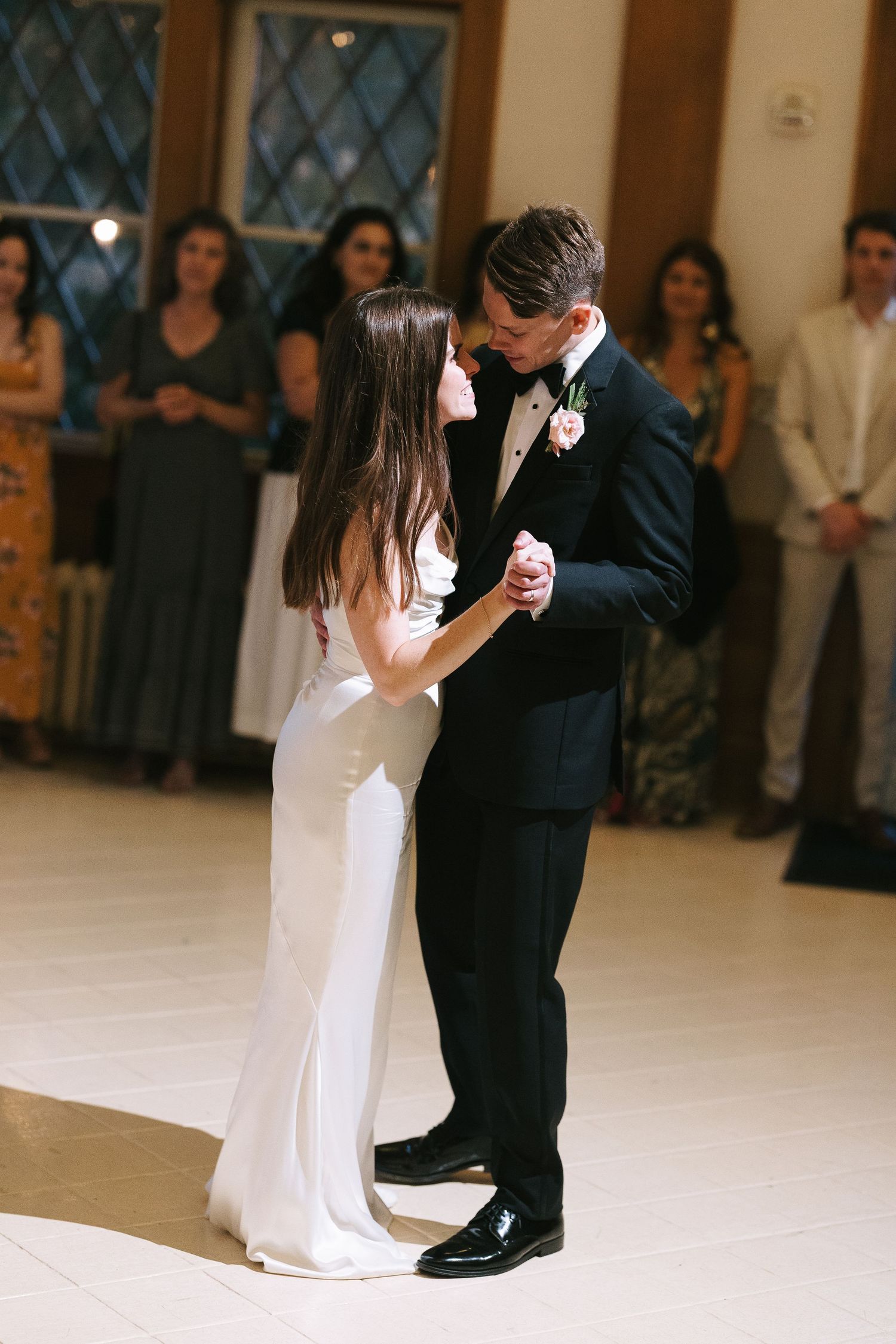 A tender moment shared during a formal dance.