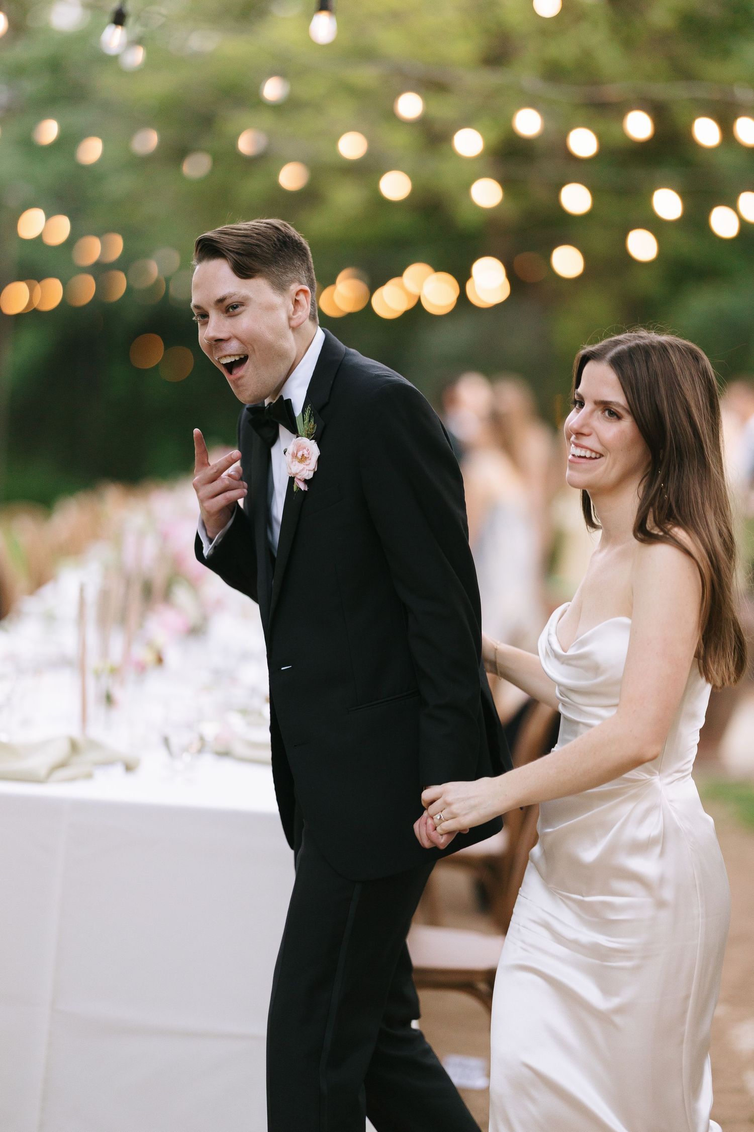 A candid moment of laughter during an outdoor reception.