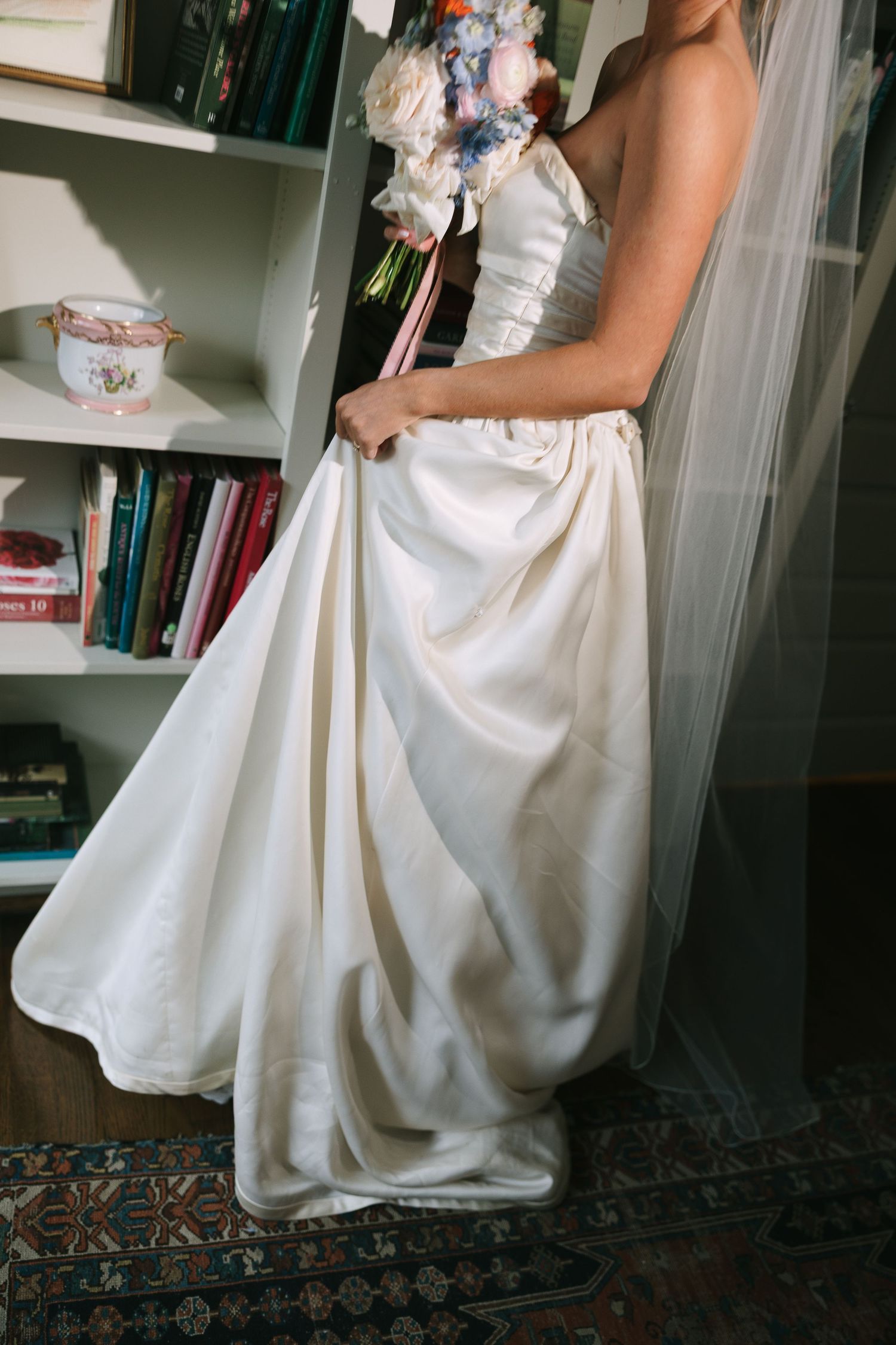 Detail shots of white wedding dress skirt and fabric.