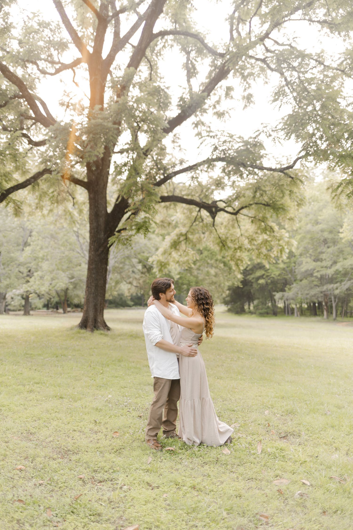 A romantic photoshoot sequence in a park showing tender moments between two people while doing a photoshoot.