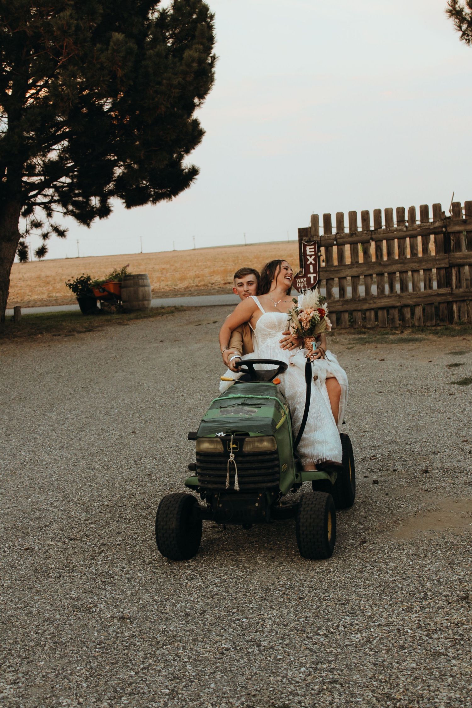 wedding couple on lawn mower
