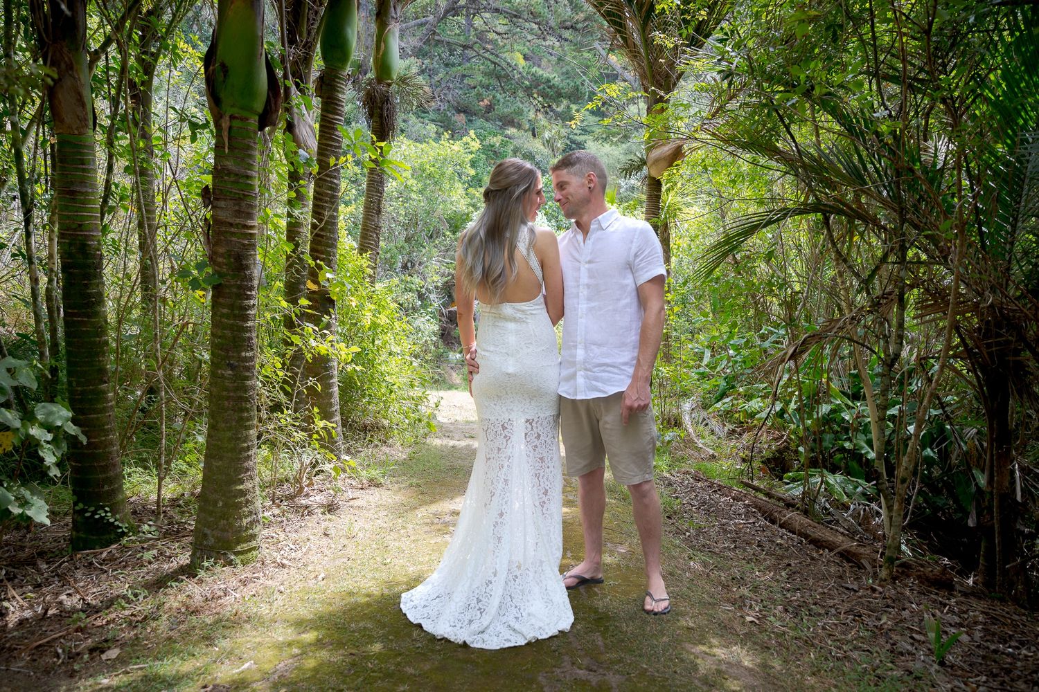 Auckland North Shore Wedding Photographer: Married couple portrait walking through the woods after saying 'I do'