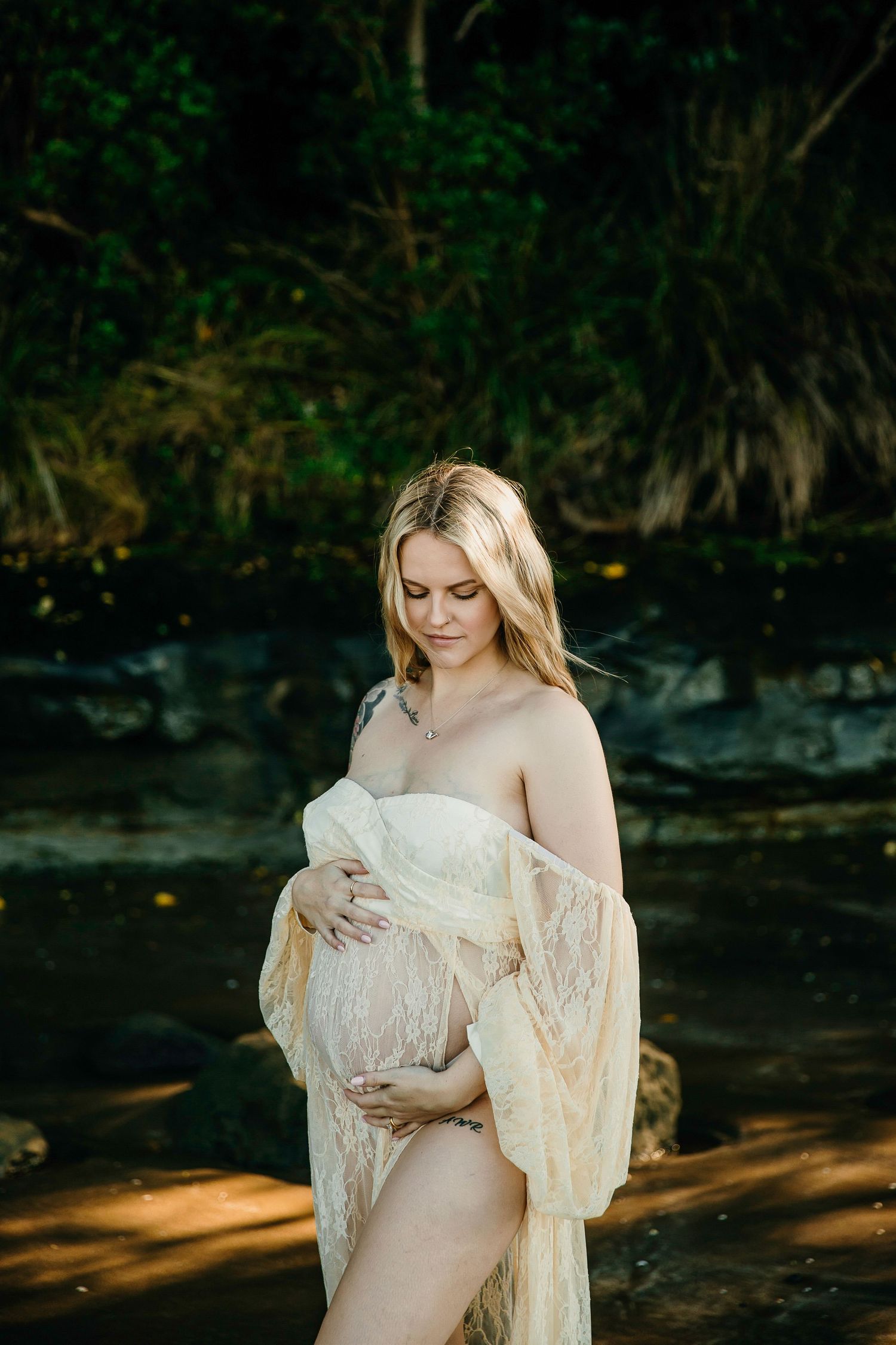 Auckland Maternity Close-up: Mum-to-be holding her pregnant belly on a beautiful North Shore beach.