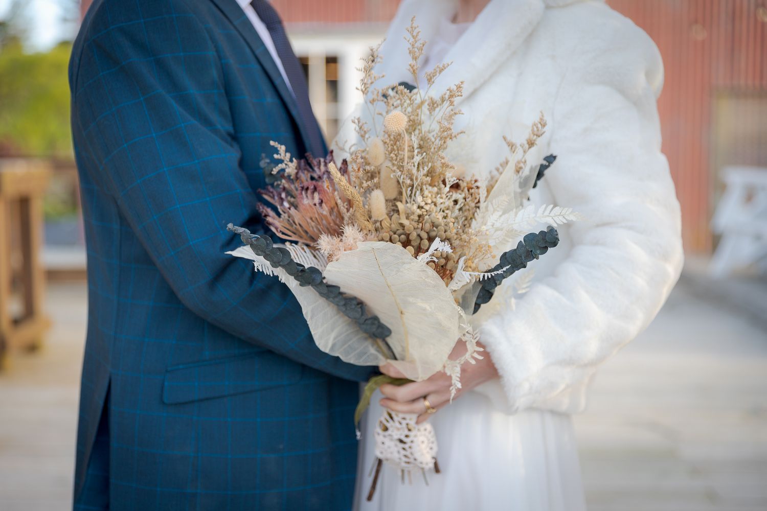 Auckland Wedding Photographer: Bride and Groom portrait with wedding flowers, captured by Shara-Lee.