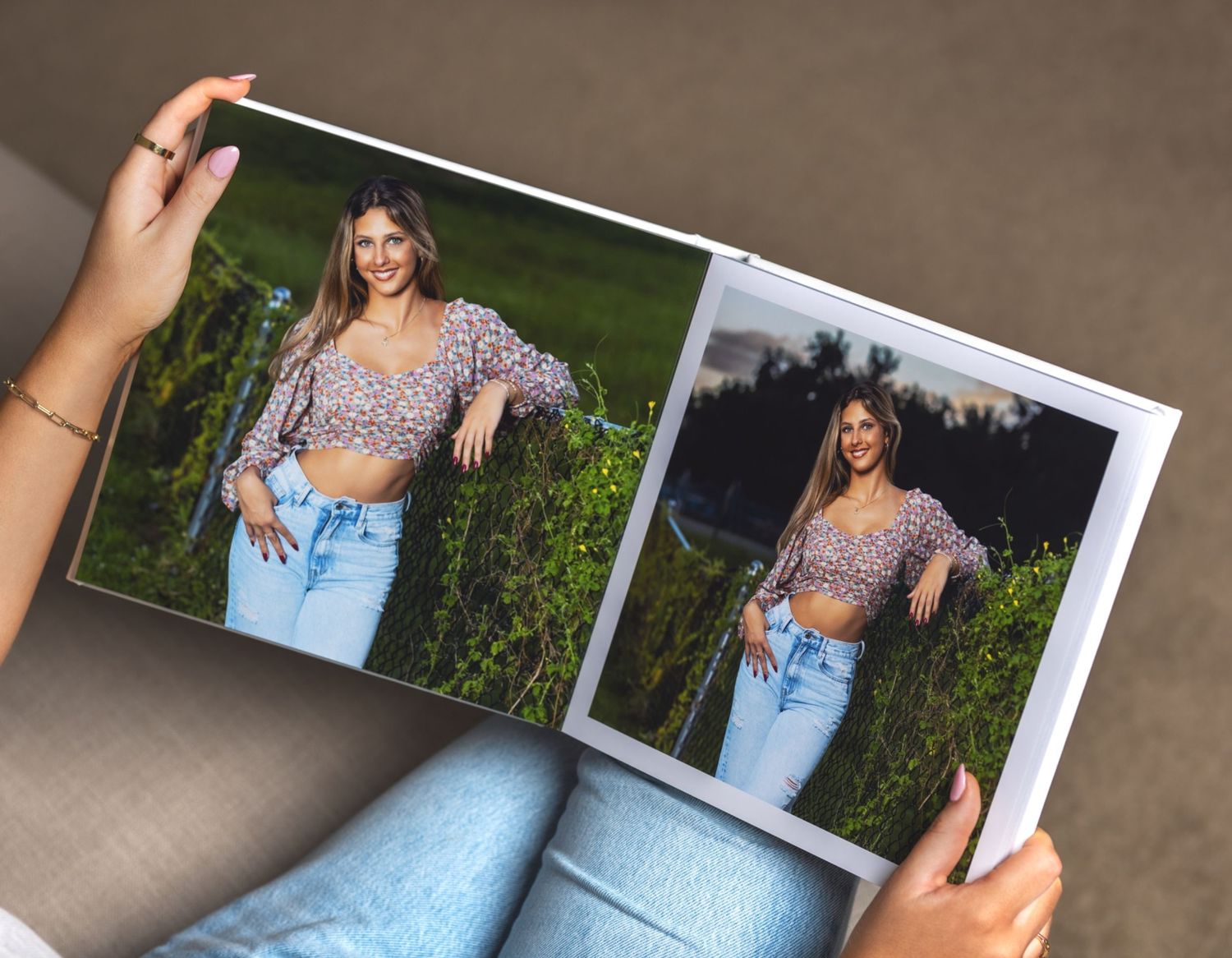 Person holding open photo book showing brunette woman posing in floral crop top and jeans.