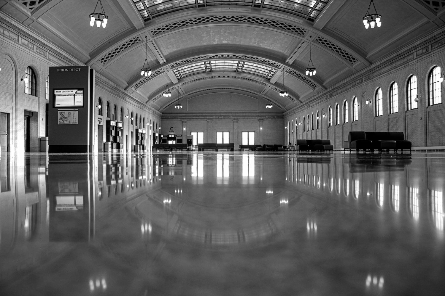 Train station hall with arched ceiling, reflective floors, and elegant architecture. Union Depot Saint Paul, MN