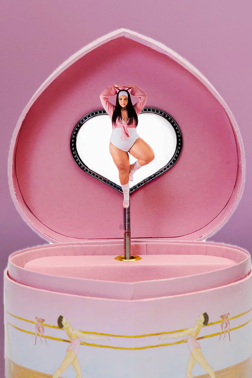A plus-size woman in a white bodysuit poses inside a pink heart-shaped jewelry music box against a lavender background.