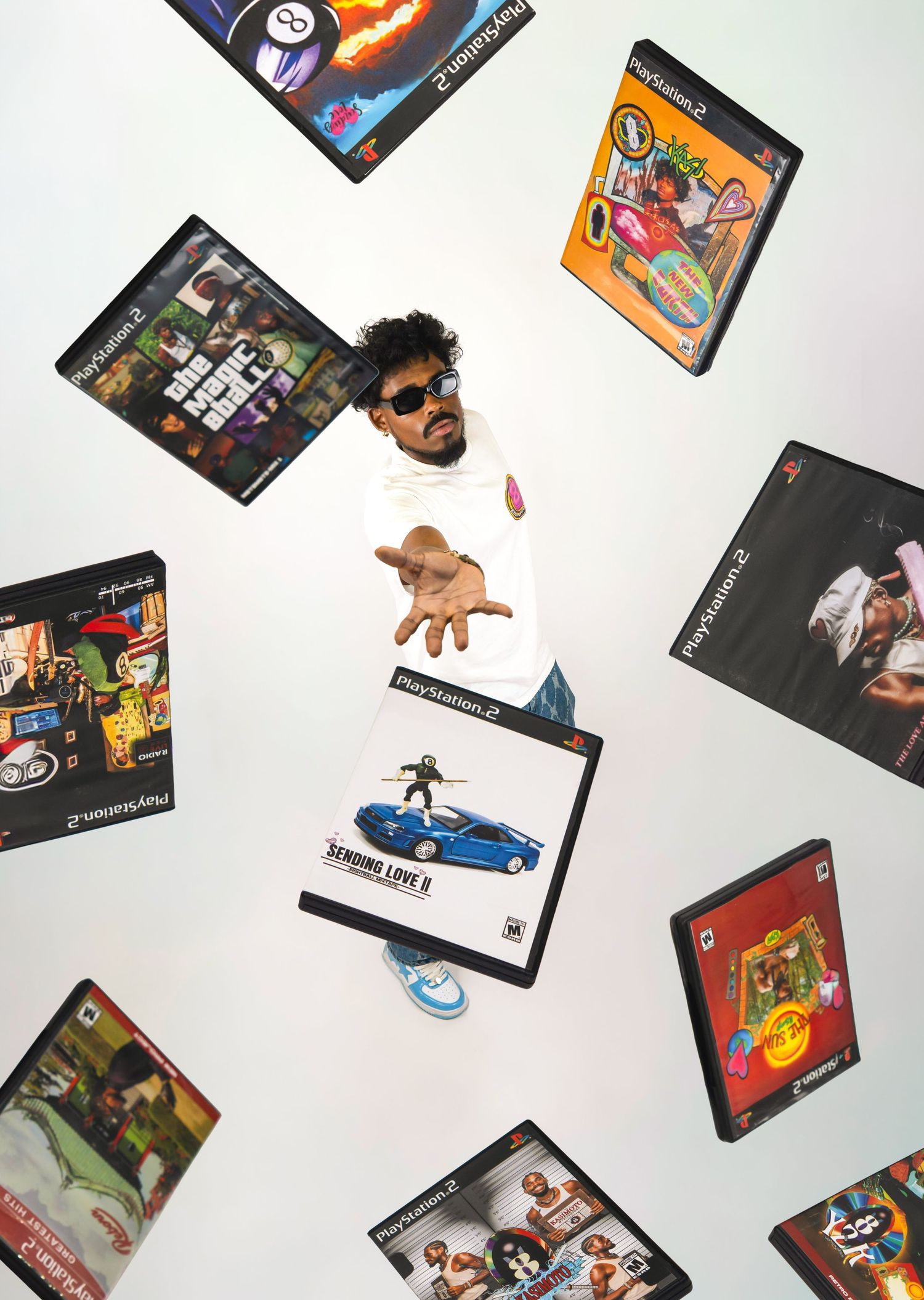 Creative photo of a man surrounded by floating PS2 video game cases.