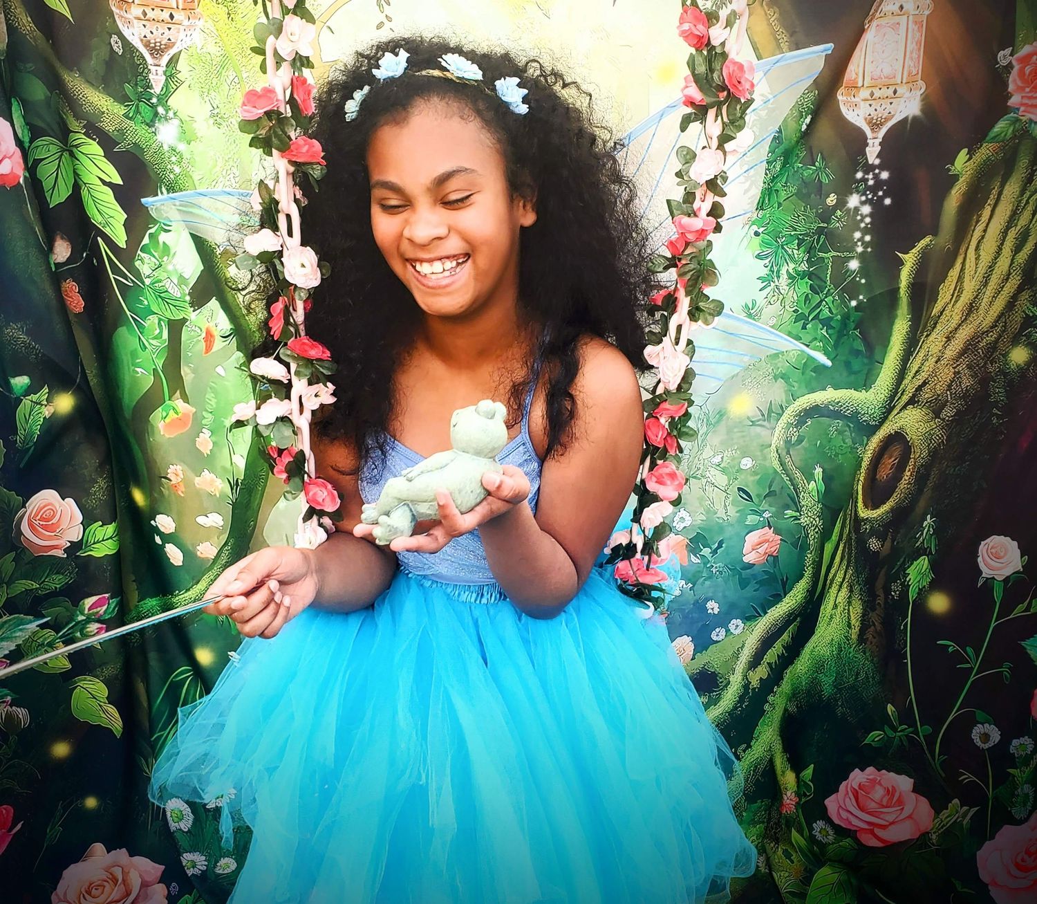 Fairy laughing with a frog in her hand, Fairy Treasures Photography in Cypress, TX; fairytale photographer in Cypress and Katy, TX