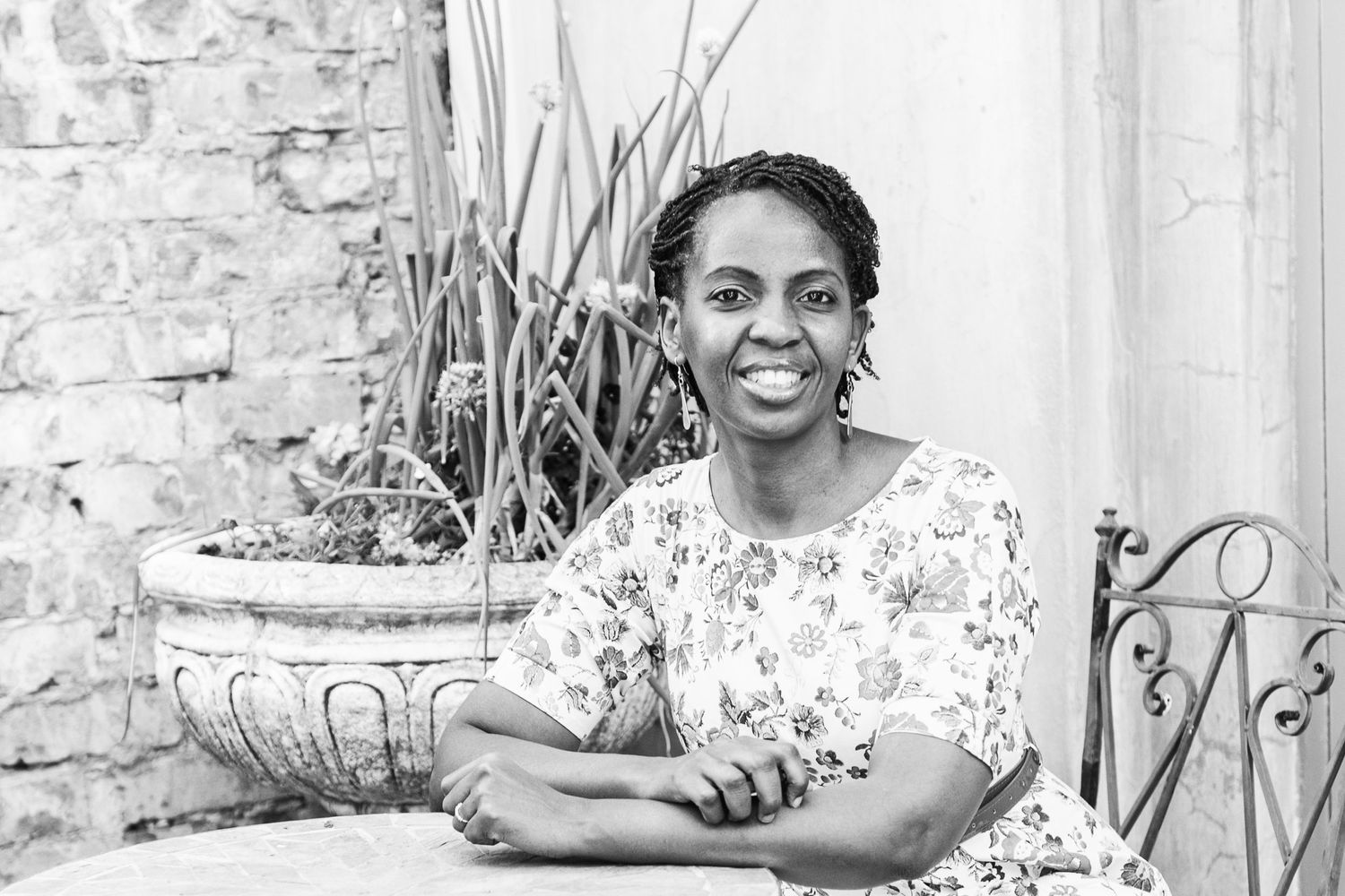 Mercy Koimburi photographer sitting at a table