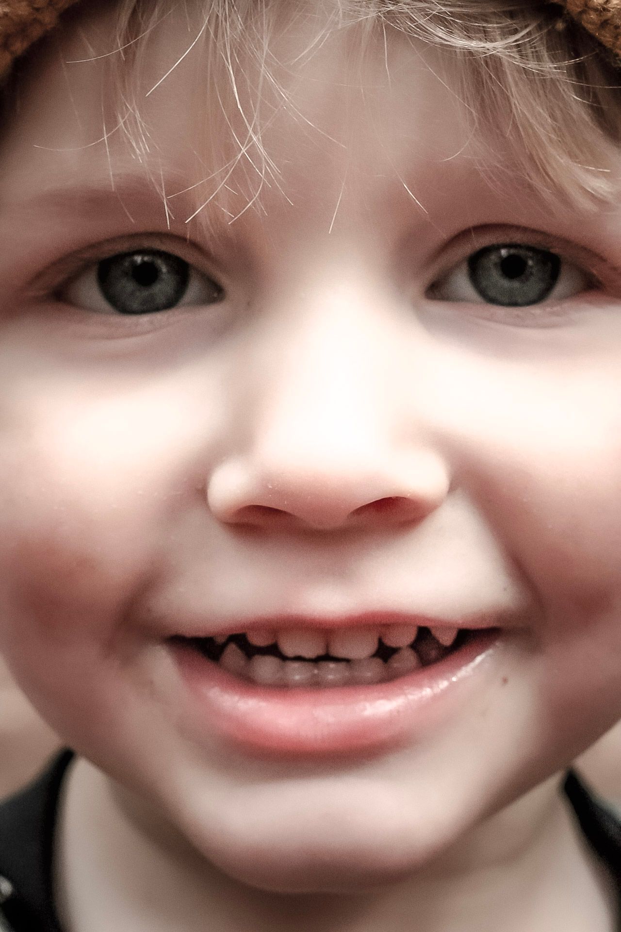 A close up of a boys face for his childhood portrait.