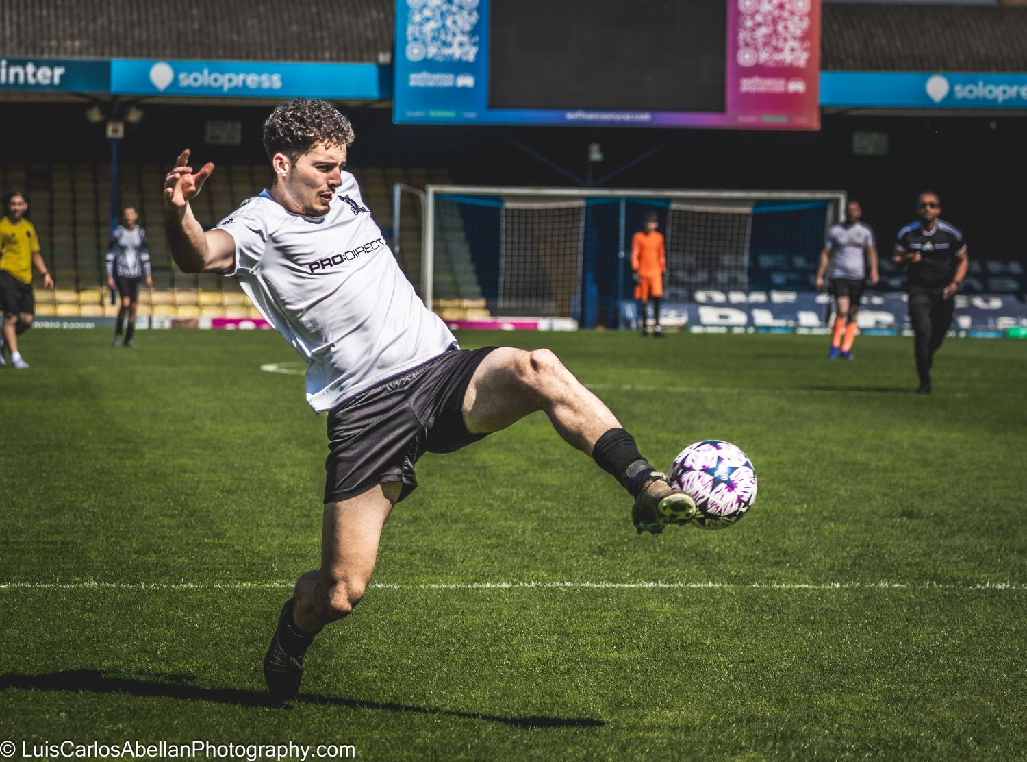 Mid-air shot of a football player juggling a ball in Kent, UK. action sports photography by Luis Carlos Abellan.
