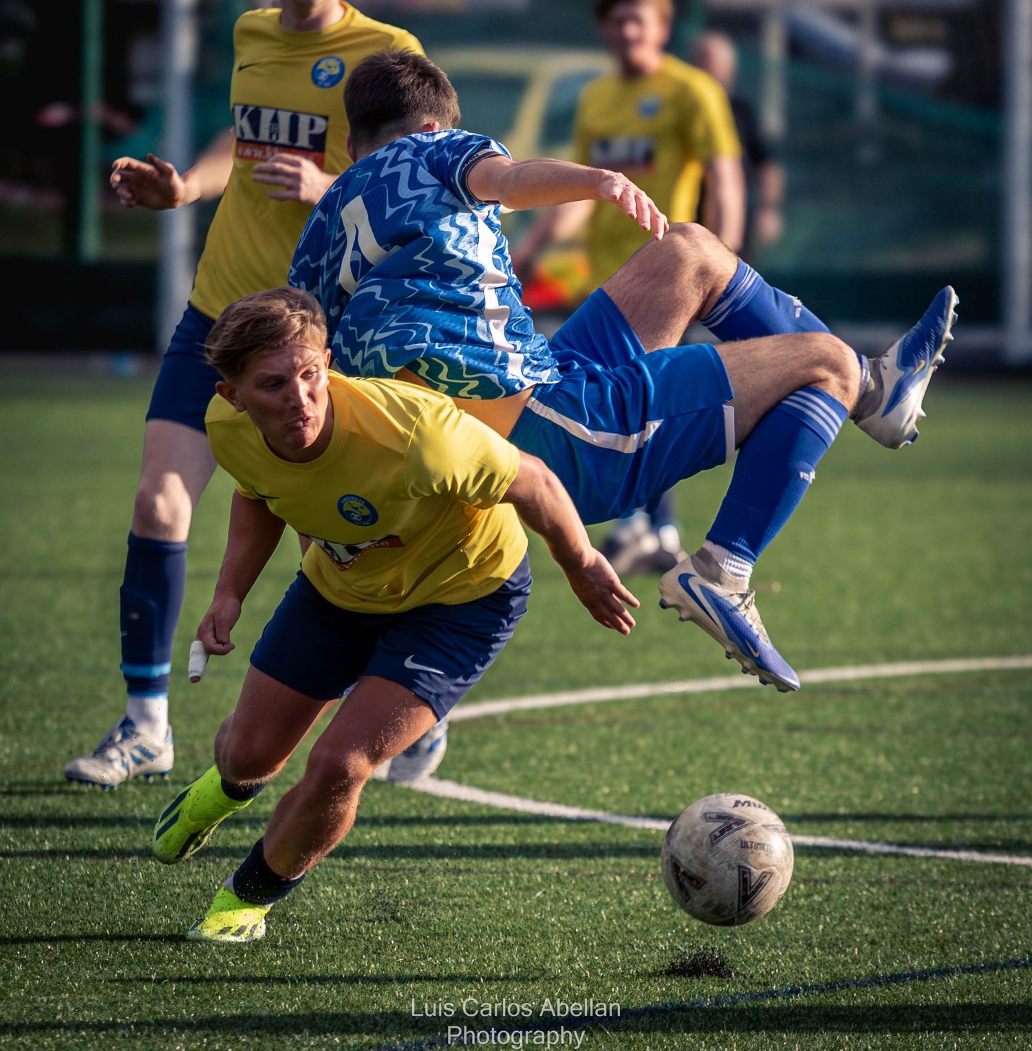Footballers in a high-intensity mid-air collision during a match in Aylesford, captured by Luis Carlos Abellan Photography.