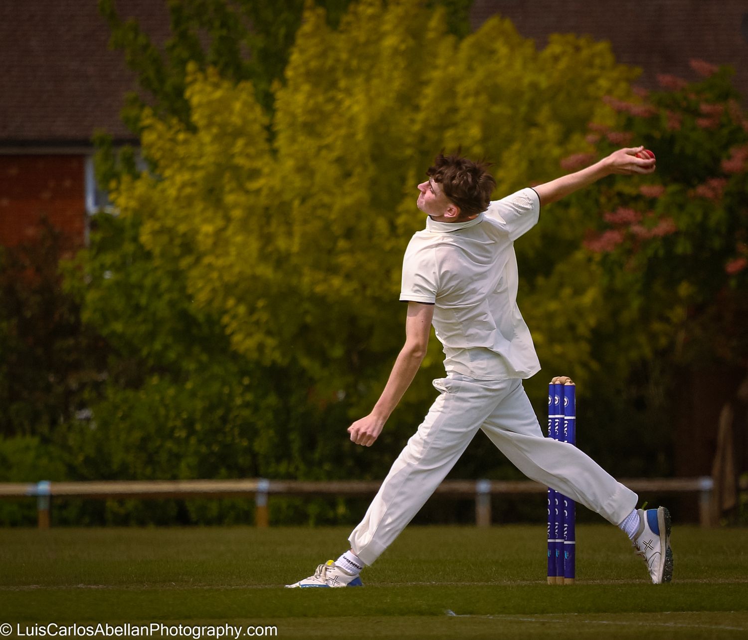 Focused sports action: a cricket player delivering the ball during a local match. Image by Luis Carlos Abellan Photography.