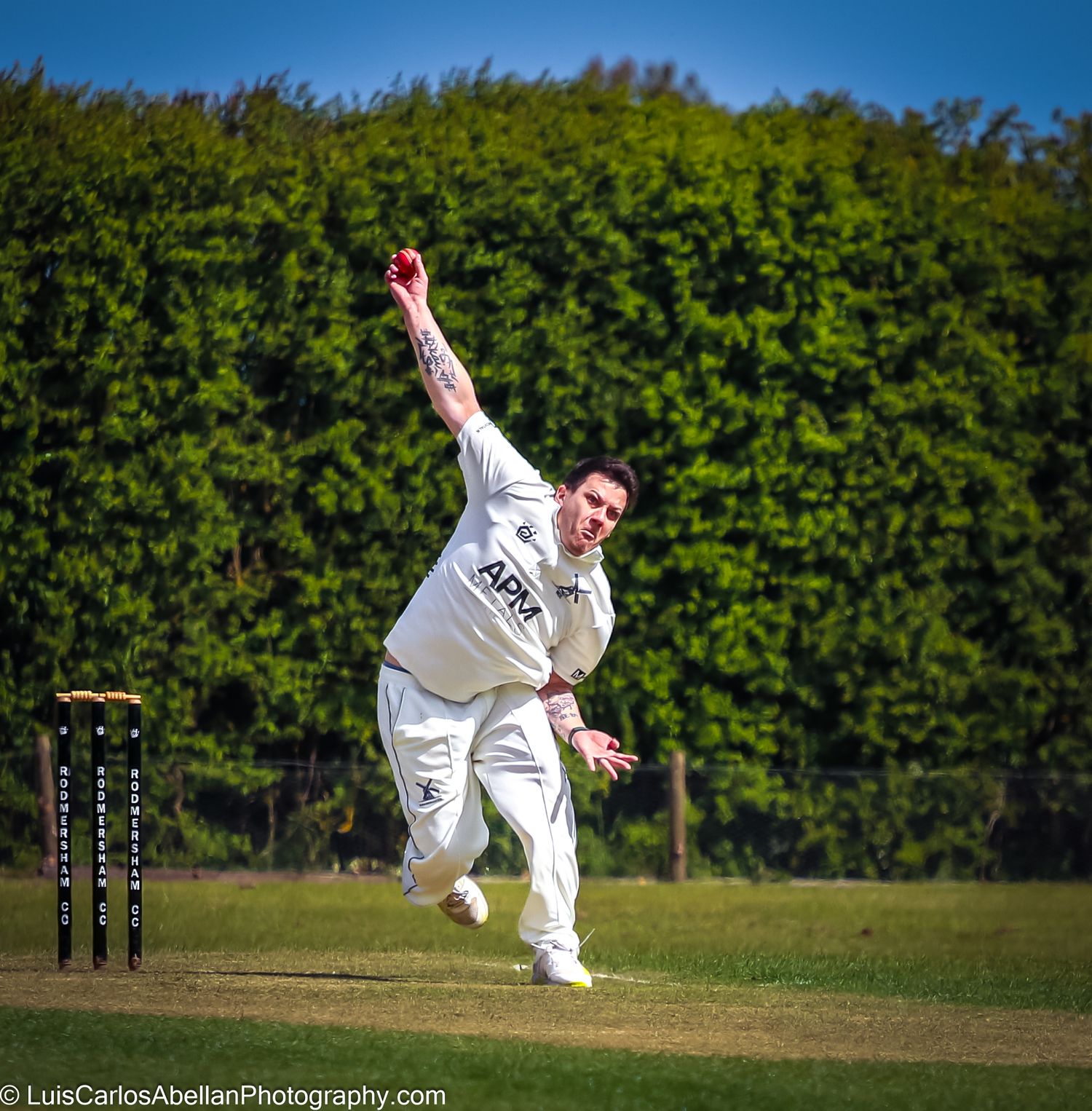 A cricketer in action, delivering a fast bowl during a match in Kent. Fine sports photography by Luis Carlos Abellan Photography.