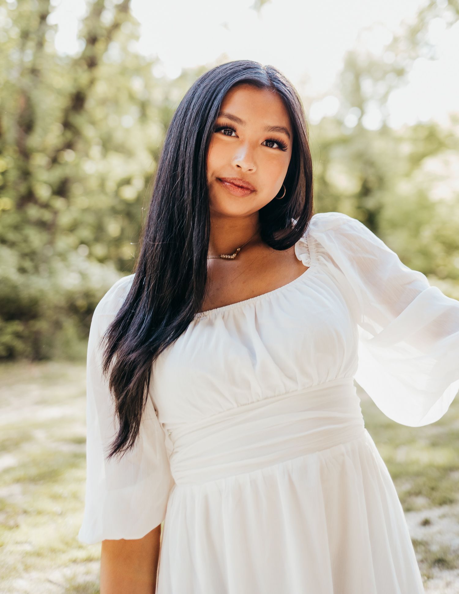 high school senior in white dress at farmers market stall in Waynesville mo