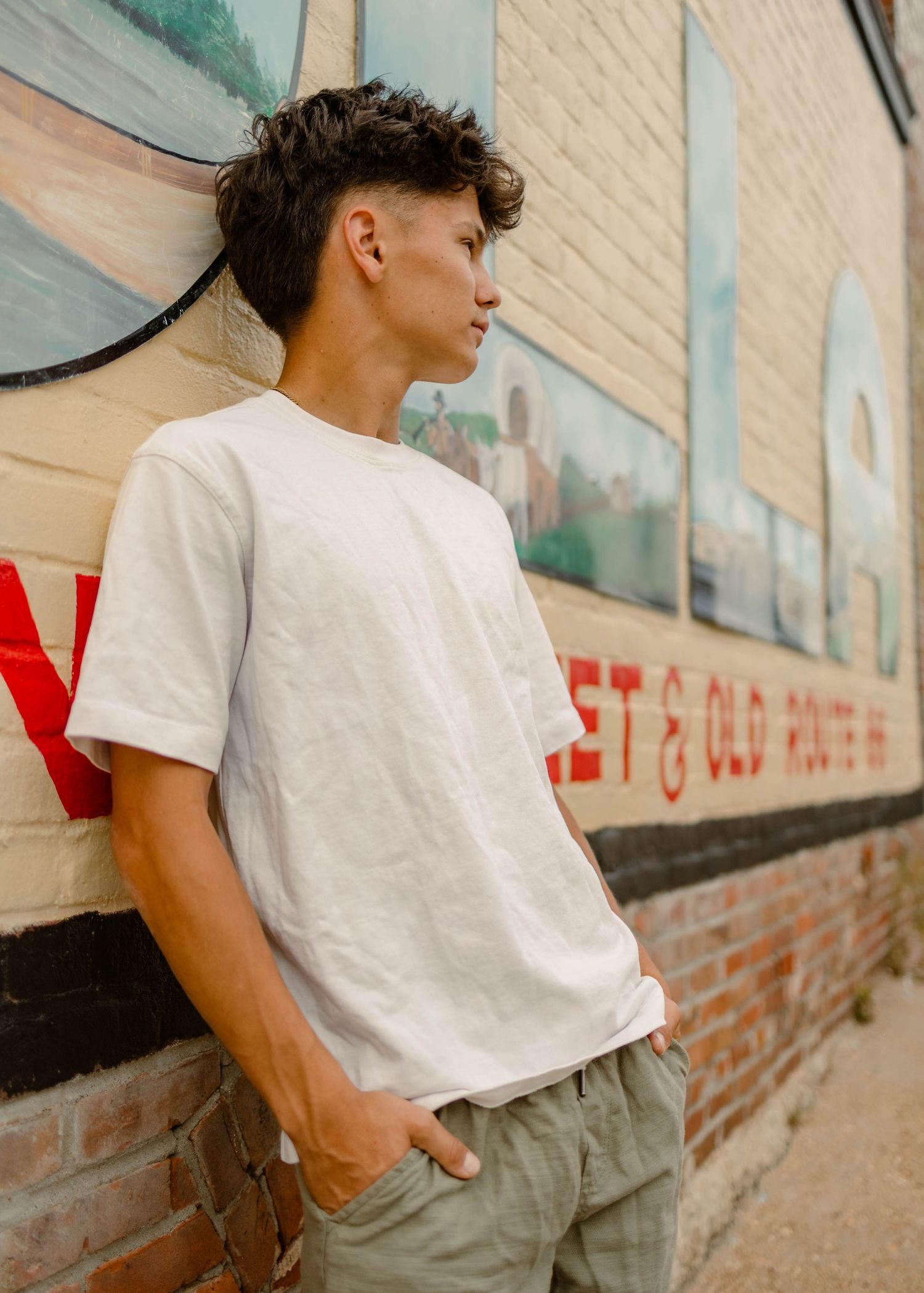 High school senior in white shirt in downtown Rolla, mo for senior photos