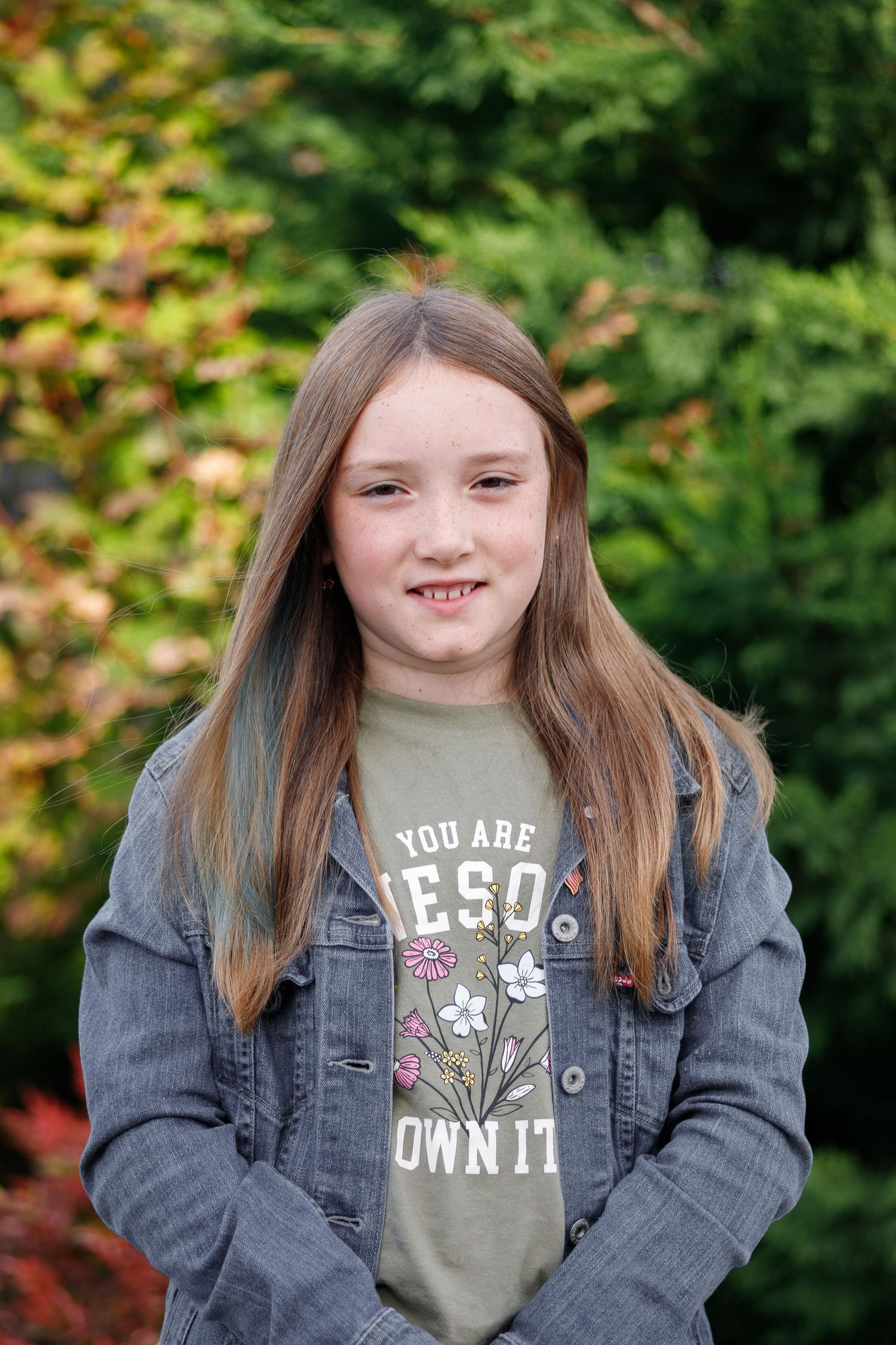 A series of outdoor portraits showing someone wearing a denim jacket and olive t-shirt against a blurred green background.