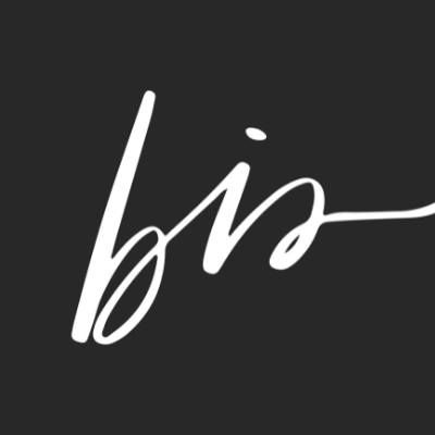 Minimalist cursive monogram logo featuring the letters bis in white on dark background.