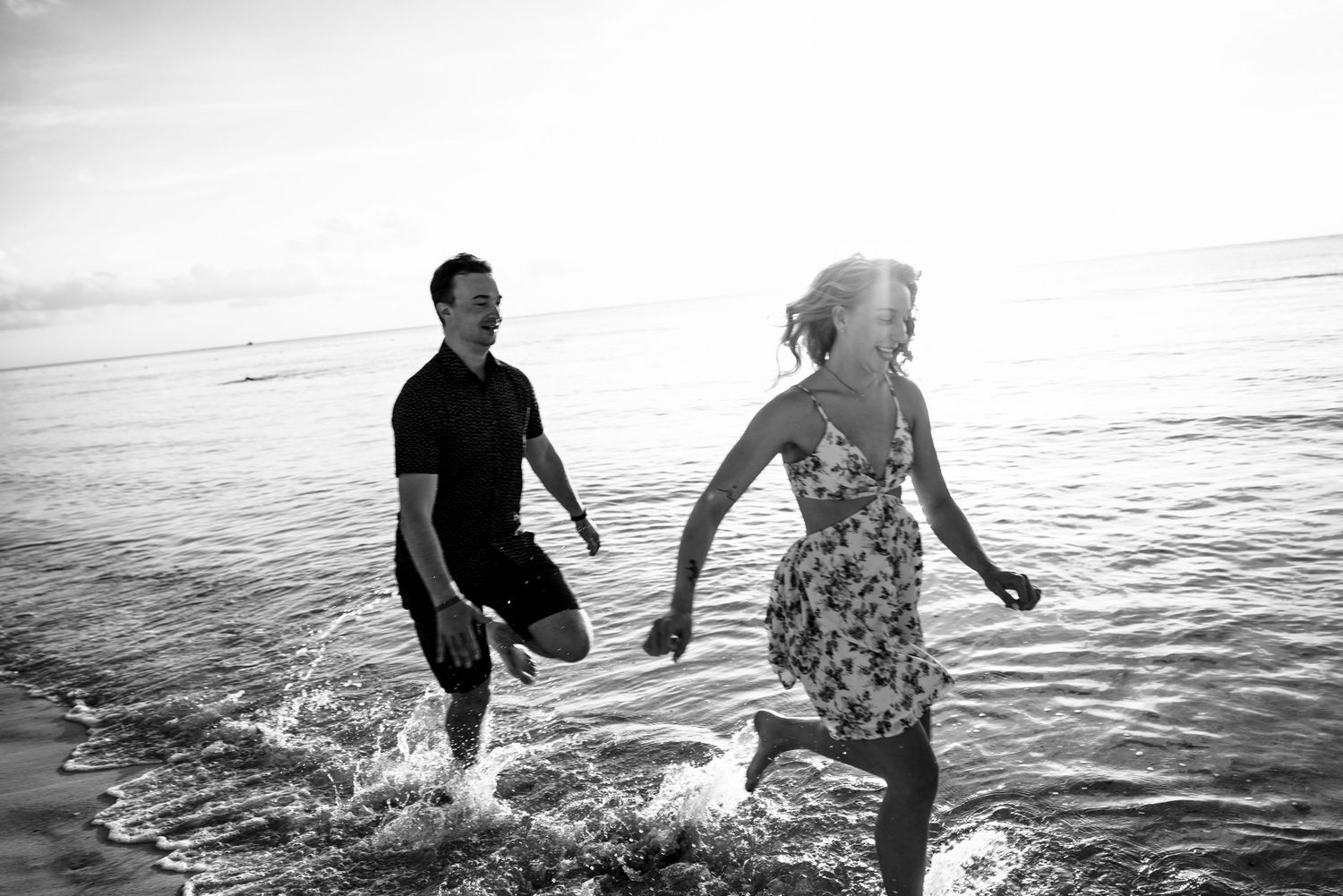 Couple enjoying a sunset beach photoshoot in Cozumel