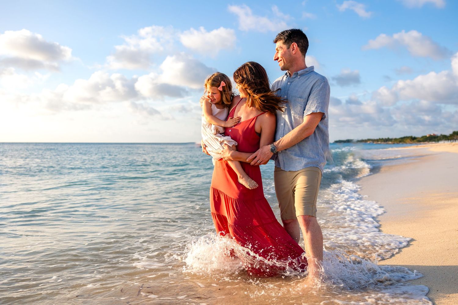 FAMILY embracing during a sunset photography session in Cozumel
