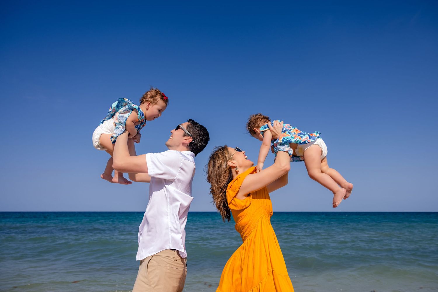 Family enjoying a beach photography session during their cruise stop in Cozumel