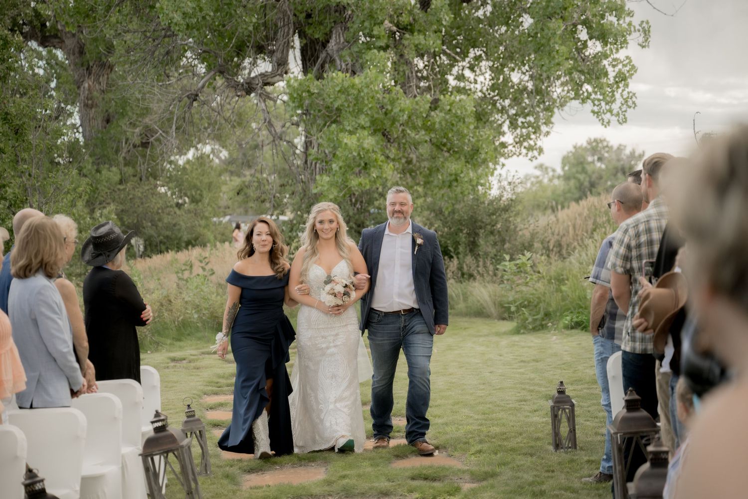 A sequence of outdoor wedding ceremony moments captured in a grassy field with trees in the background.