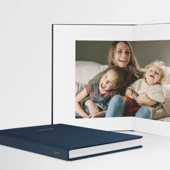 A series of photos showing people laughing and relaxing together on a navy blue mattress or couch.