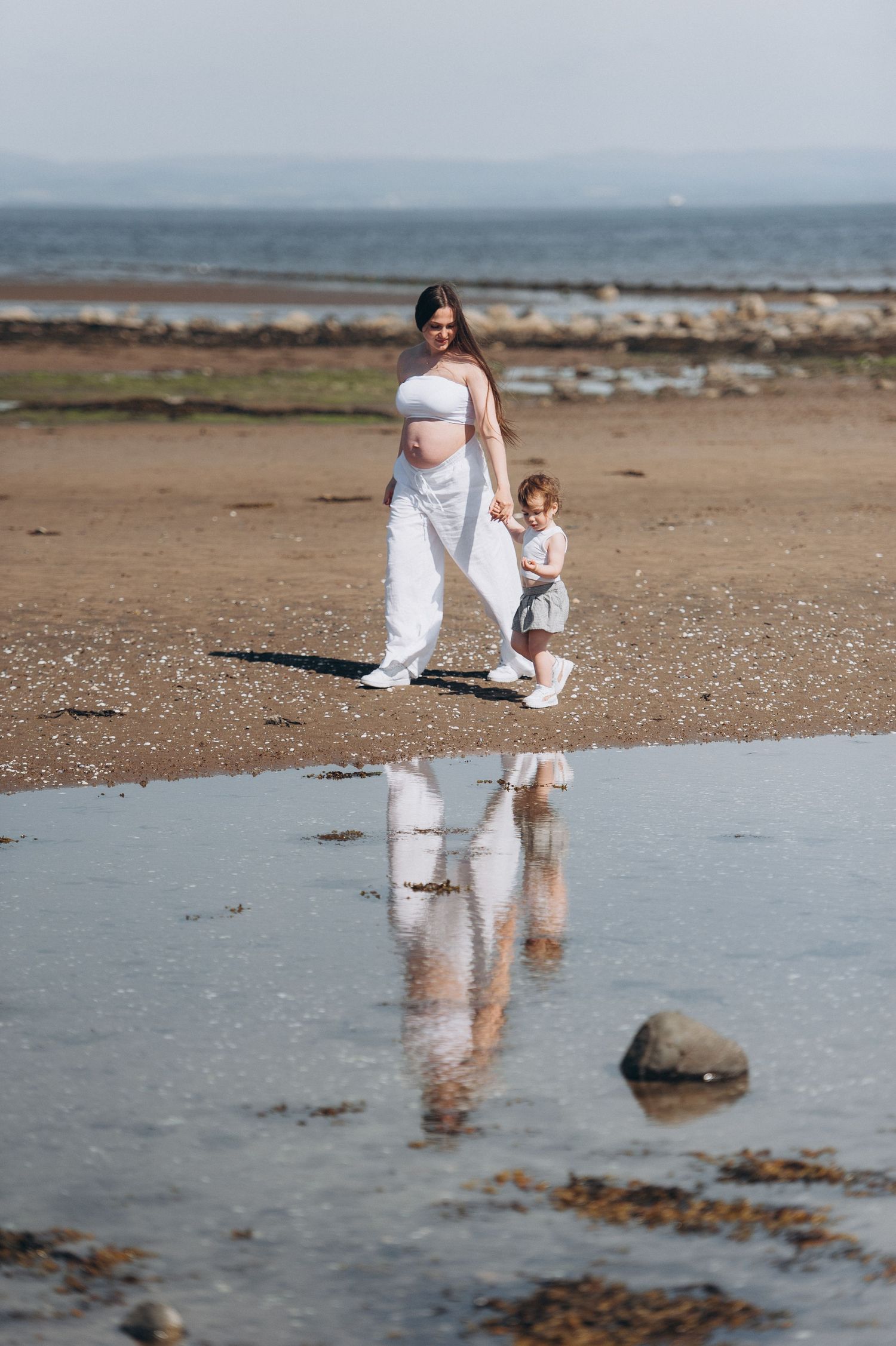 Joyful family photo celebrating the coming of a second child