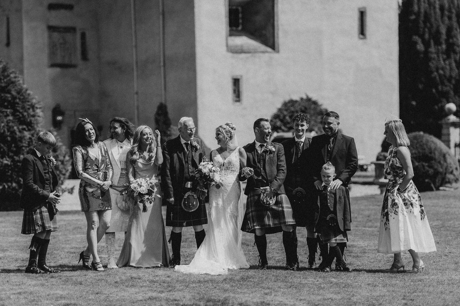 Candid photo of the couple laughing at their outdoor ceremony