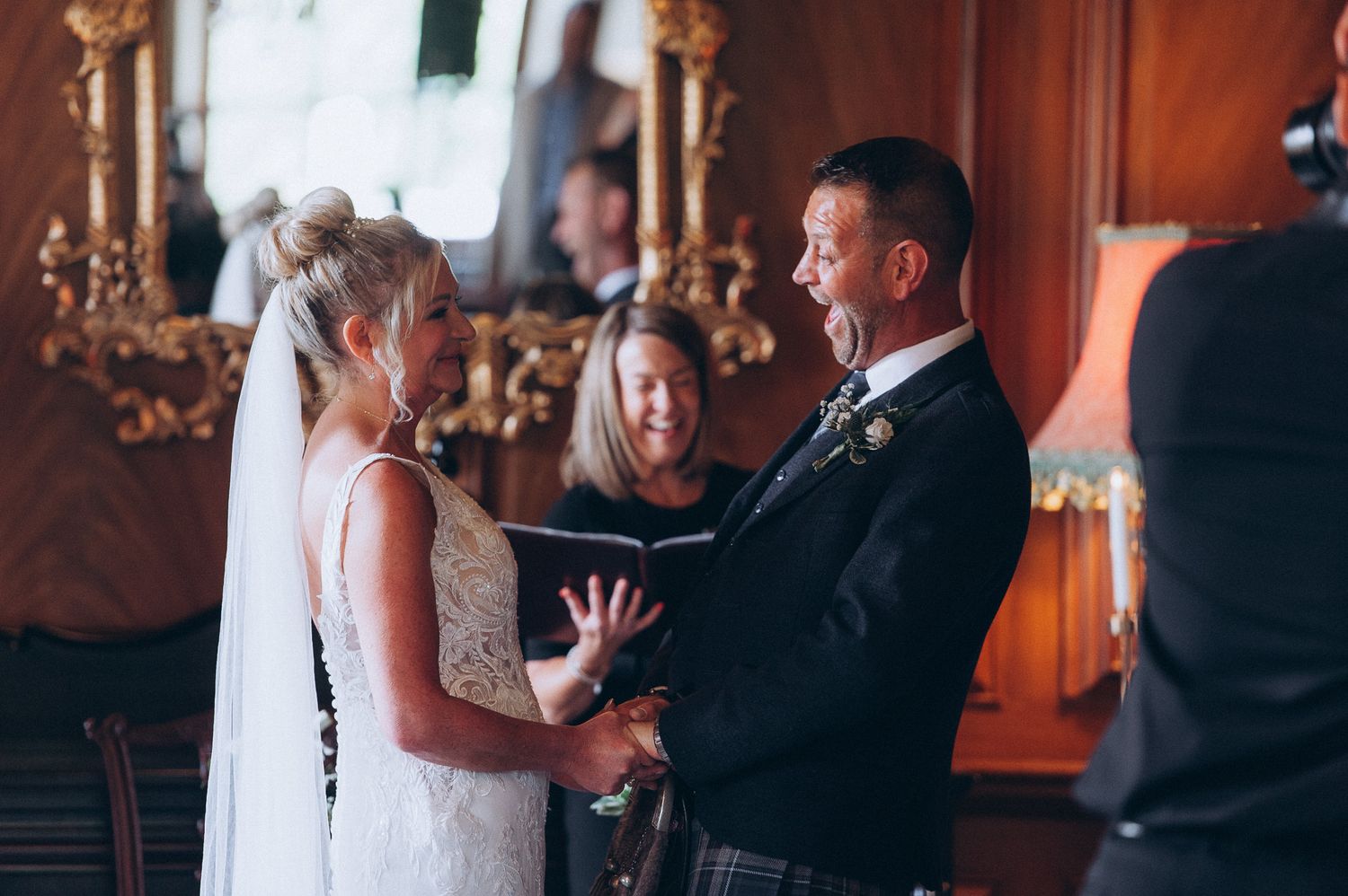 Groom adjusting his tie before the ceremony