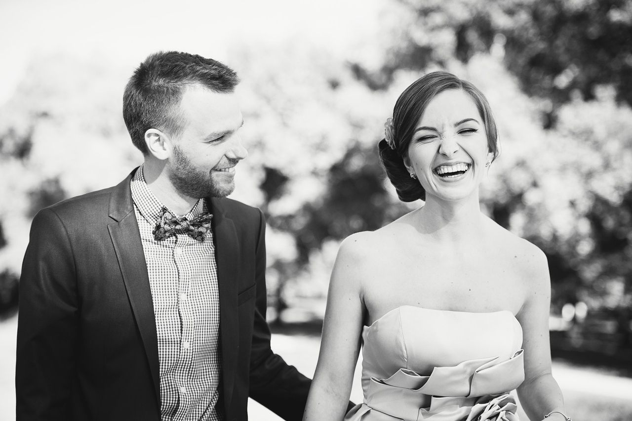 Candid photo of the couple laughing at their outdoor ceremony