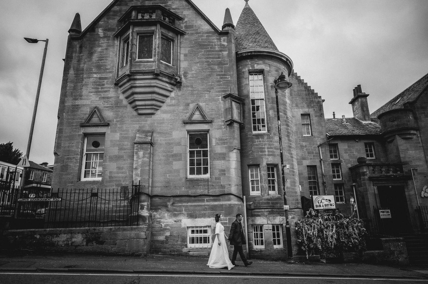 Documentary-style image of guests celebrating at the wedding reception