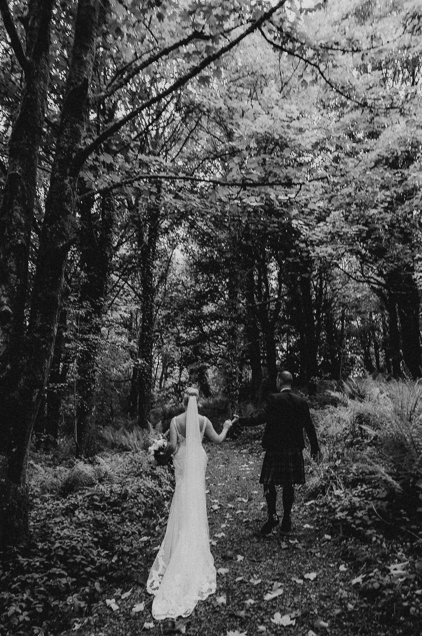 Candid photo of the couple laughing at their outdoor ceremony