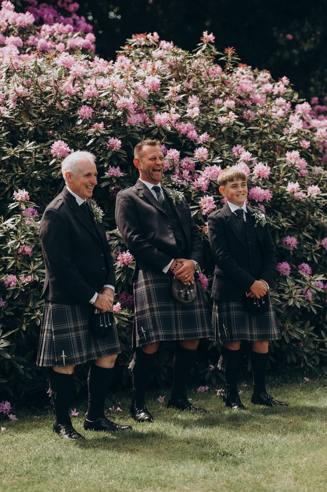 Candid photo of the couple laughing at their outdoor ceremony
