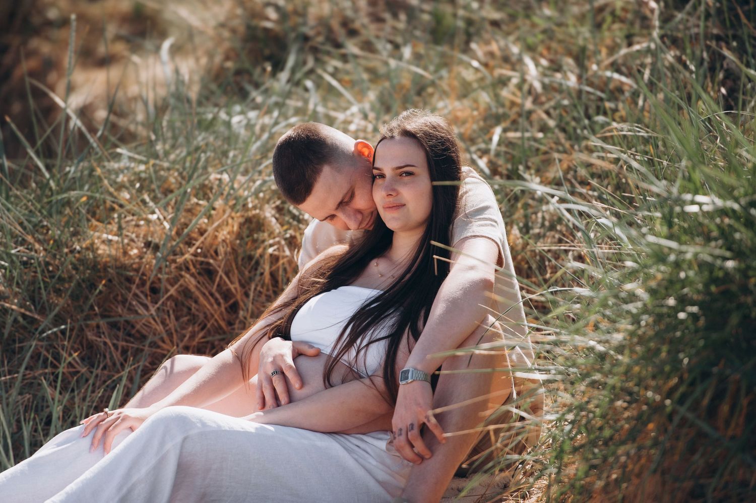 Joyful family photo celebrating the coming of a second child