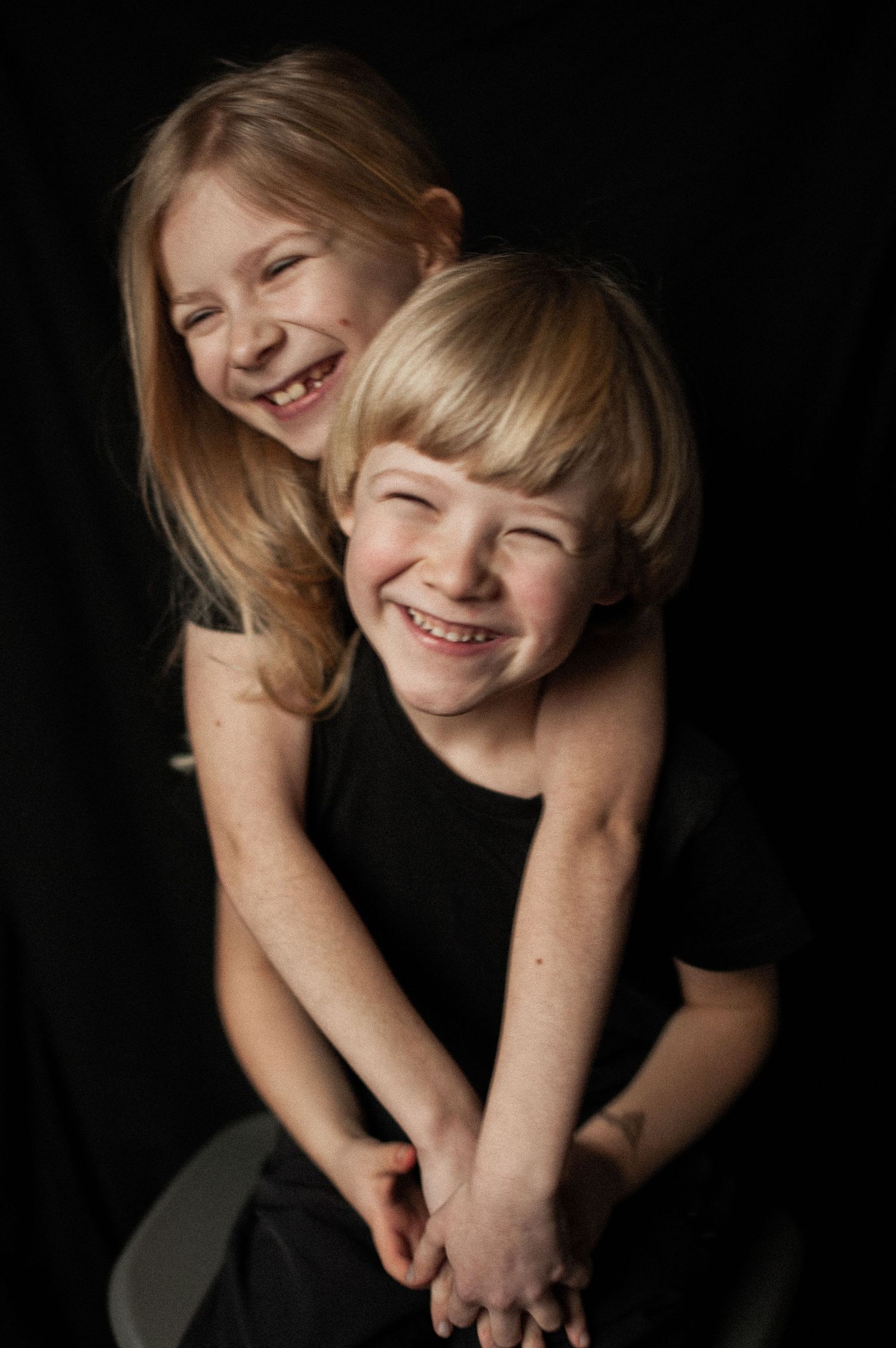 Siblings sharing a playful moment together