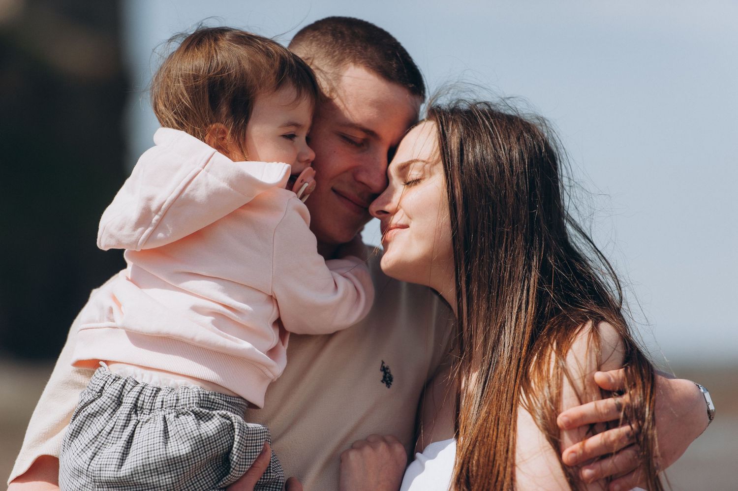 Joyful family photo celebrating the coming of a second child