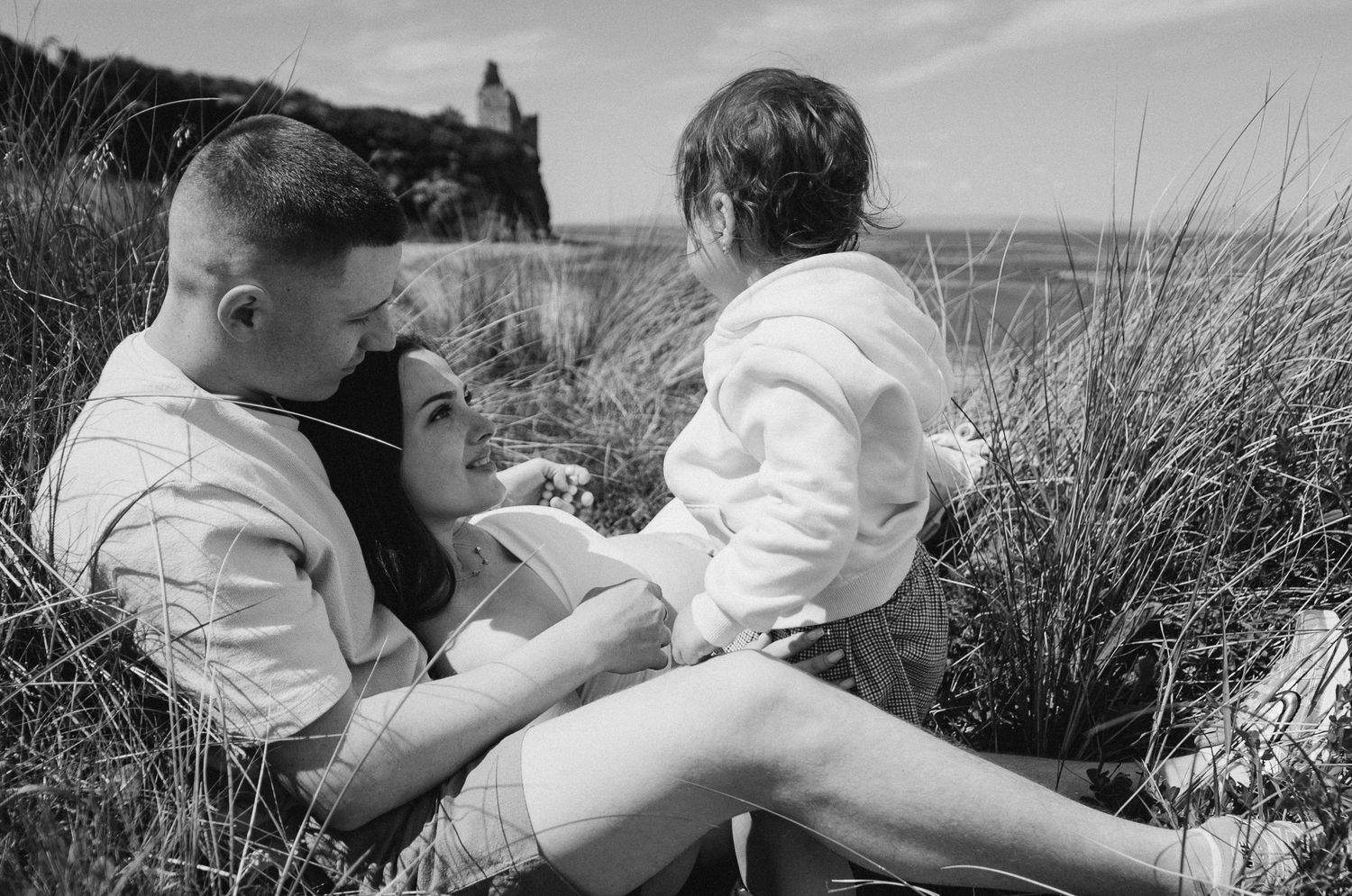 Joyful family photo celebrating the coming of a second child