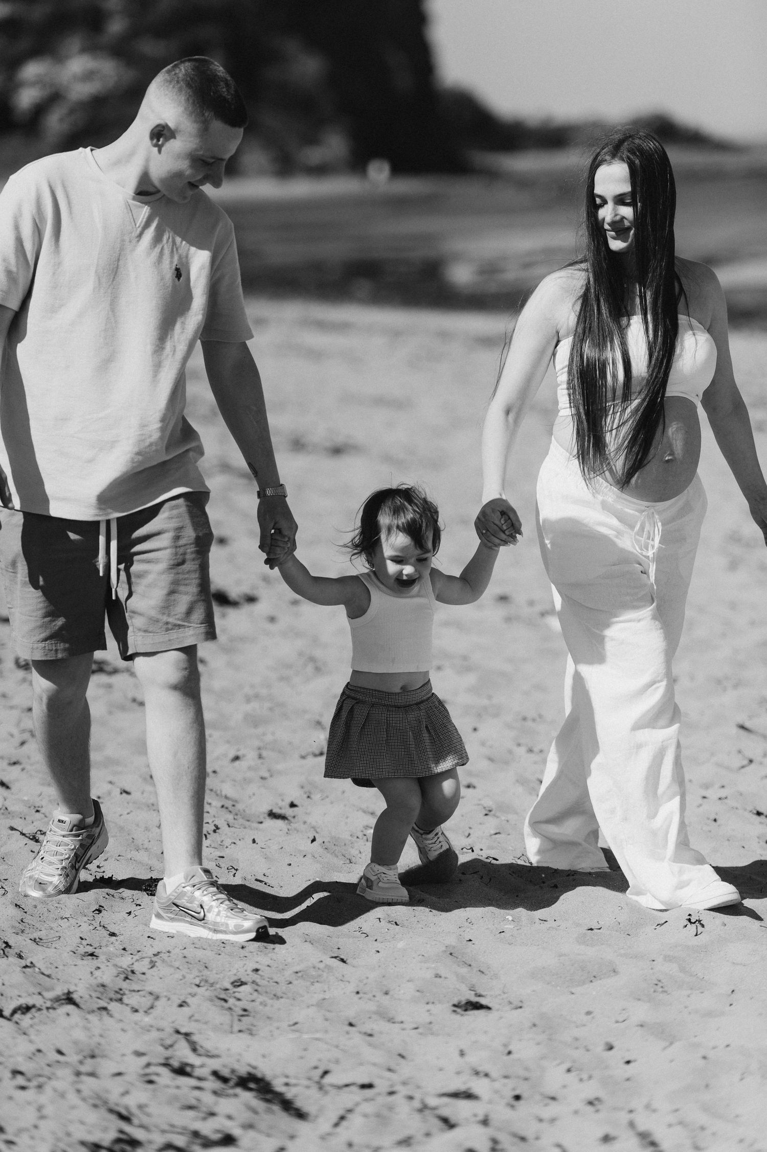 Joyful family photo celebrating the coming of a second child