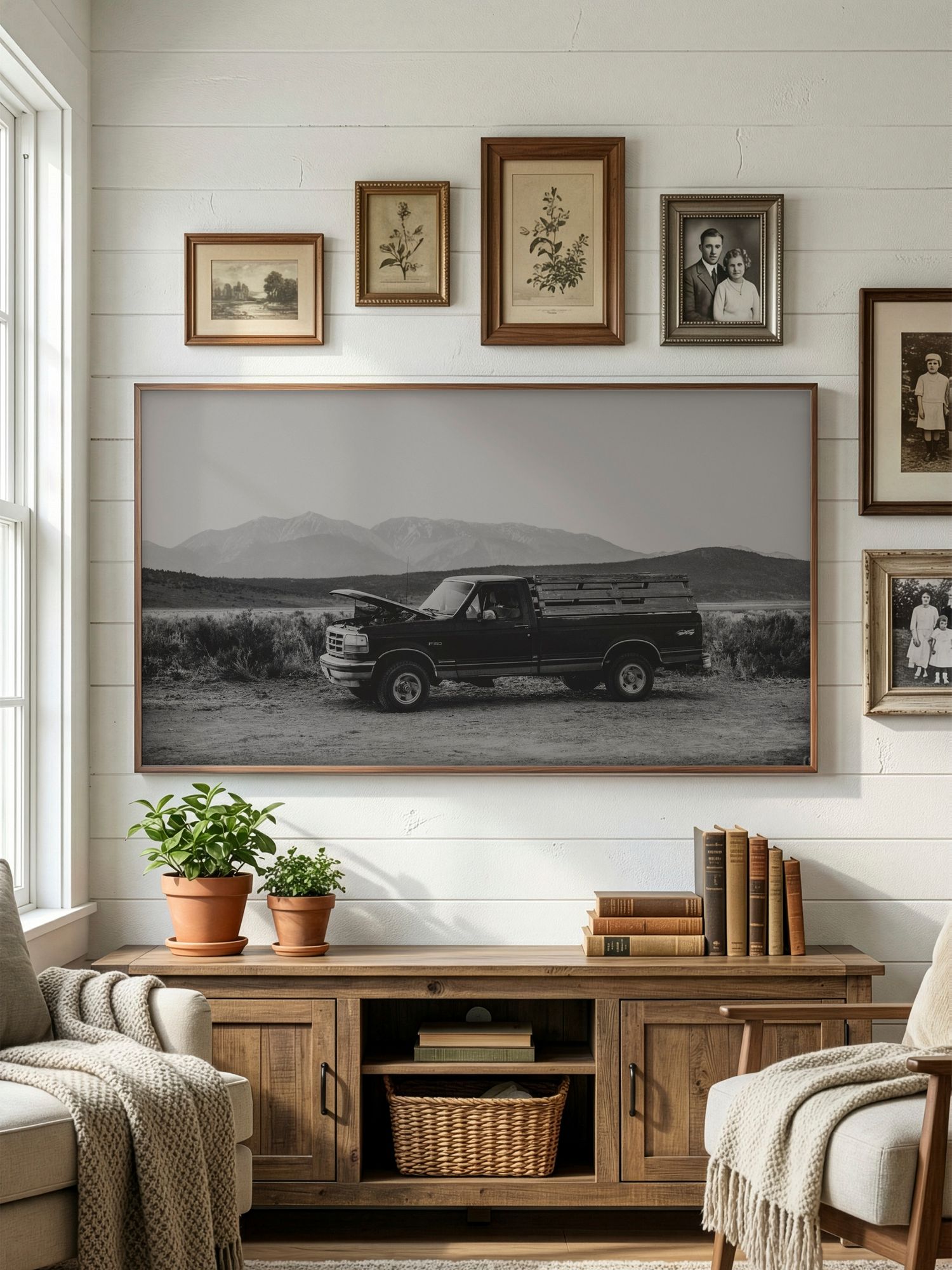 Vintage car panoramic photograph mounted above wooden media console in modern farmhouse style living room.